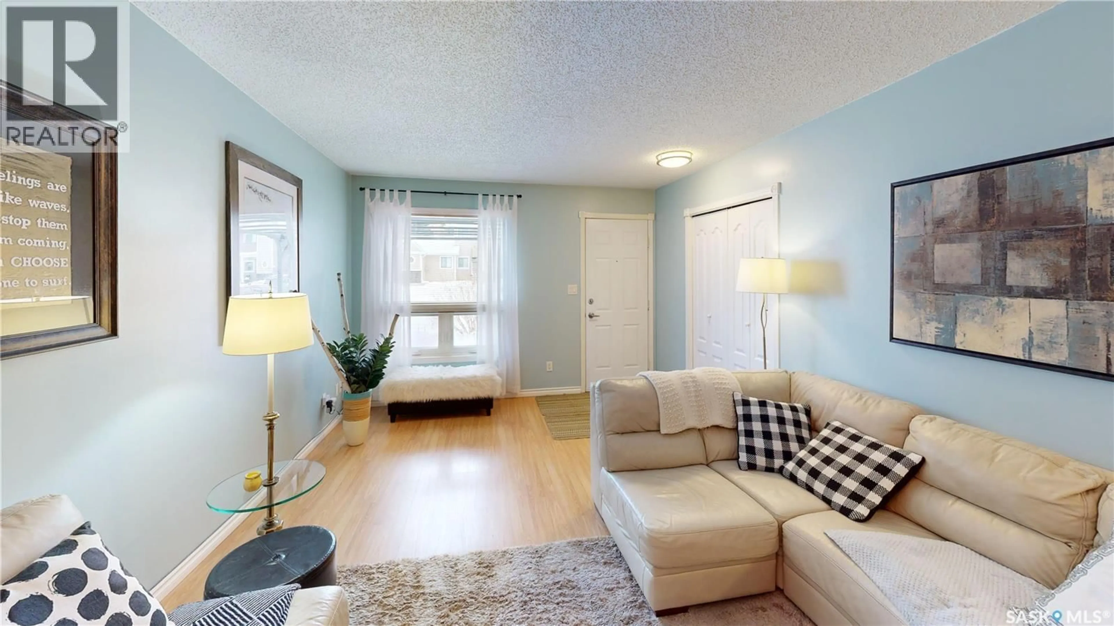 Living room with furniture, wood/laminate floor for 196 CEDAR MEADOW DRIVE, Regina Saskatchewan S4X3J6