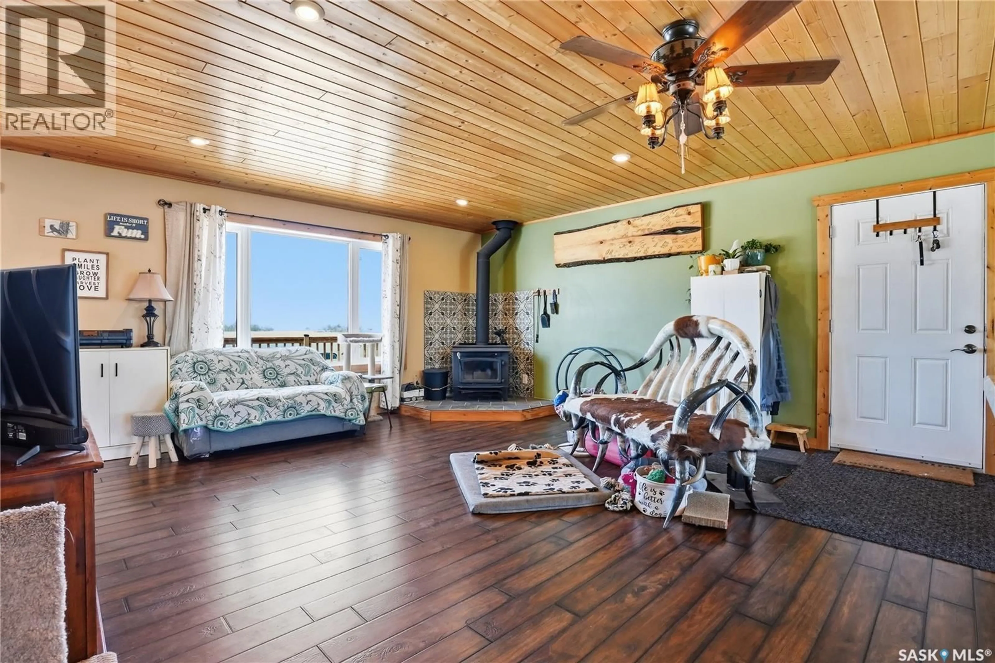 Living room with furniture, wood/laminate floor for ALBUS ACREAGE, Corman Park Rm No. 344 Saskatchewan S0K2L0