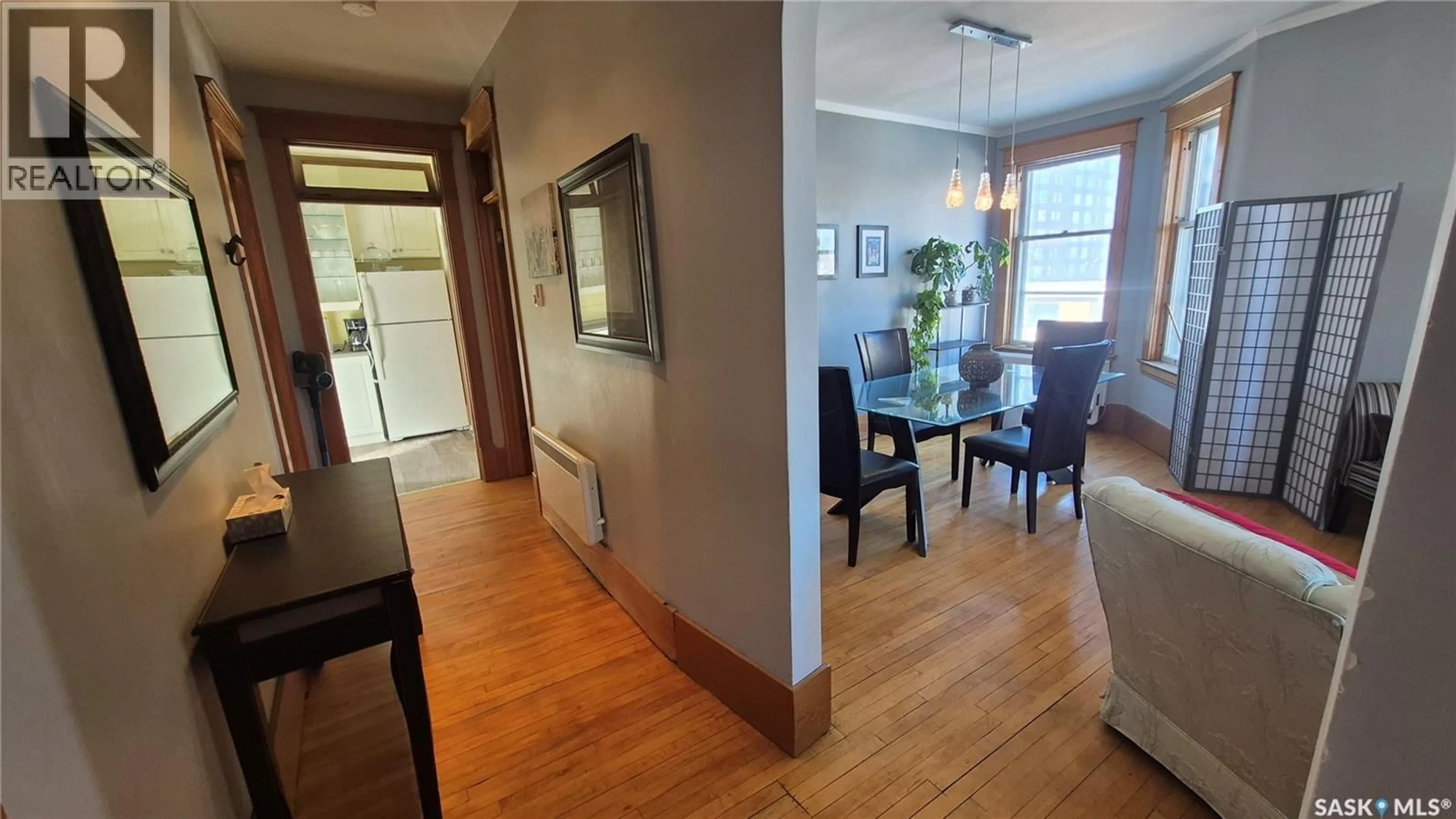 Dining room, wood/laminate floor for 2201 - 12 14TH AVENUE, Regina Saskatchewan S4P0X9