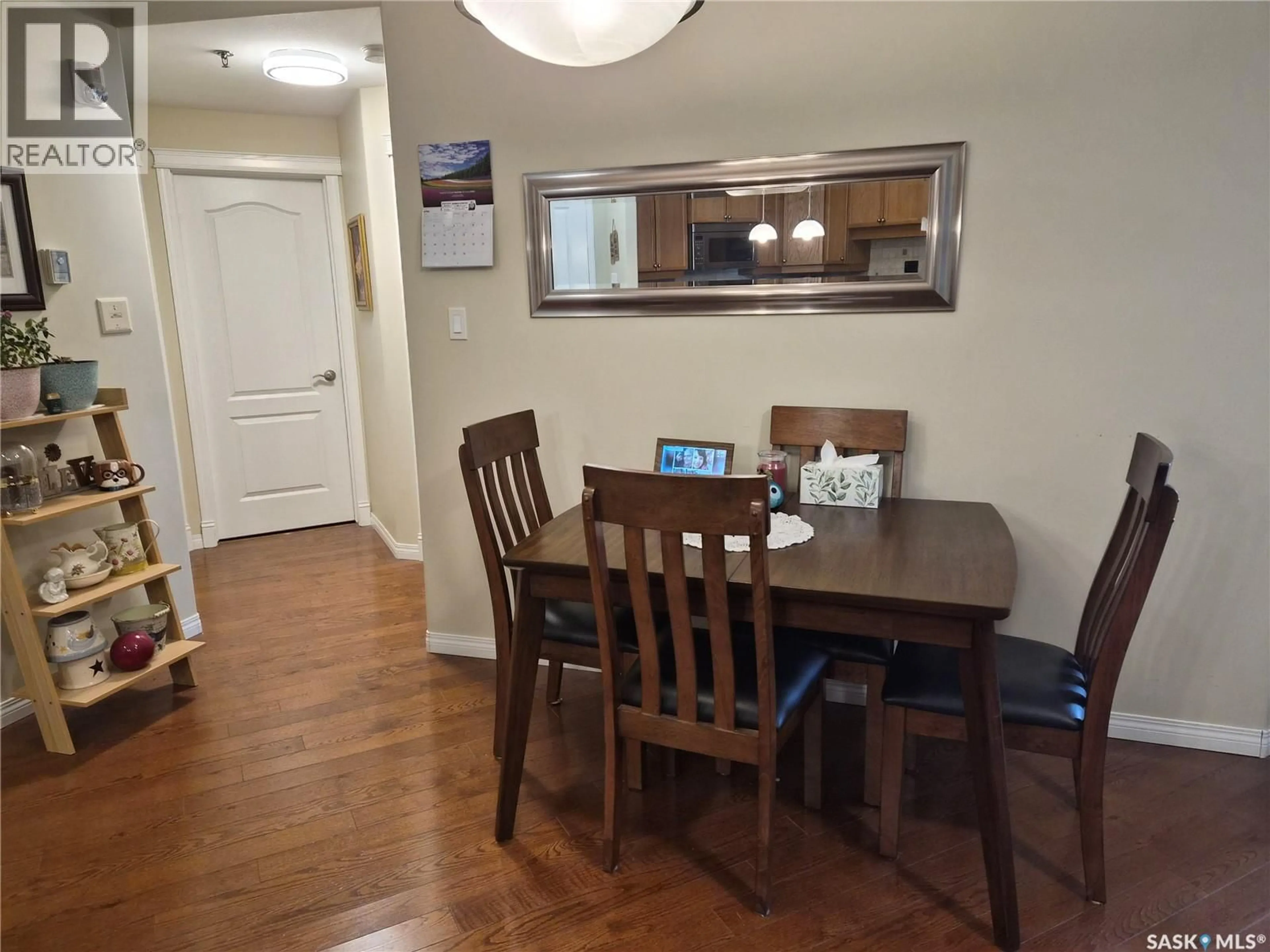 Dining room, wood/laminate floor for 108 110 ARMISTICE WAY, Saskatoon Saskatchewan S7J5L8
