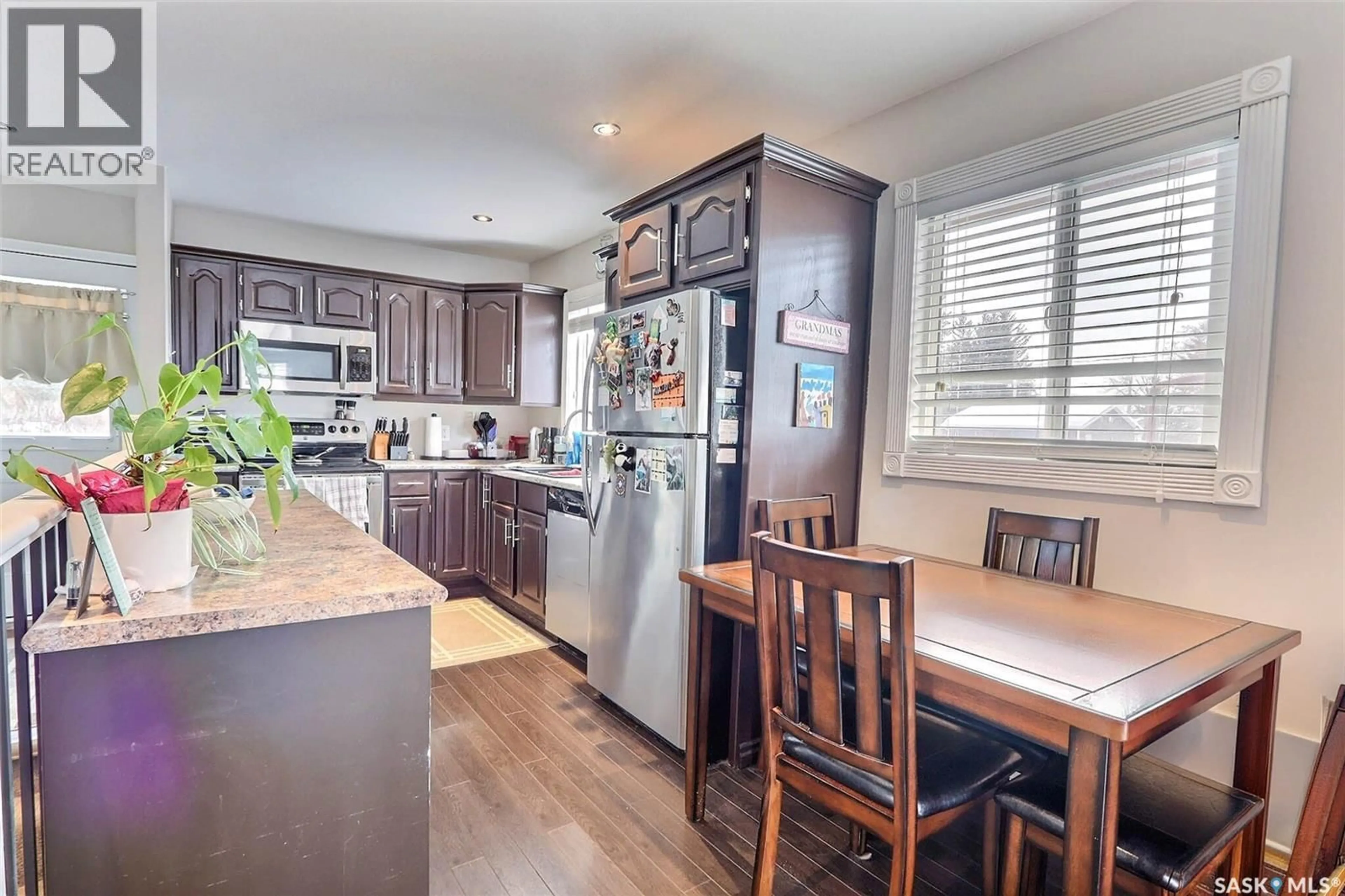 Open concept kitchen, wood/laminate floor for 122 MACARTHUR DRIVE, Prince Albert Saskatchewan S6V5X1