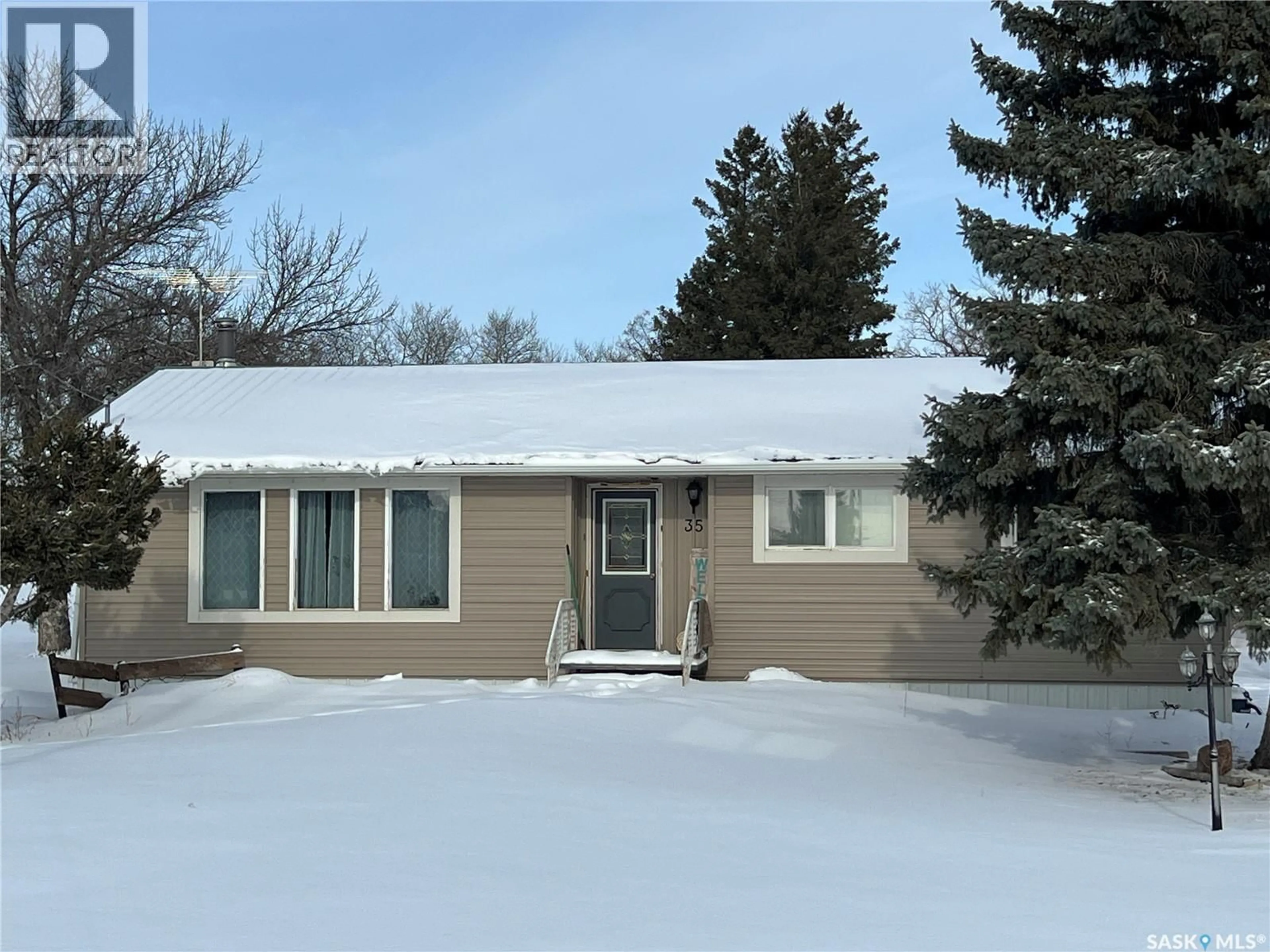 Home with vinyl exterior material, street for 35 ASSINIBOIA AVENUE, Dubuc Saskatchewan S0A0R0