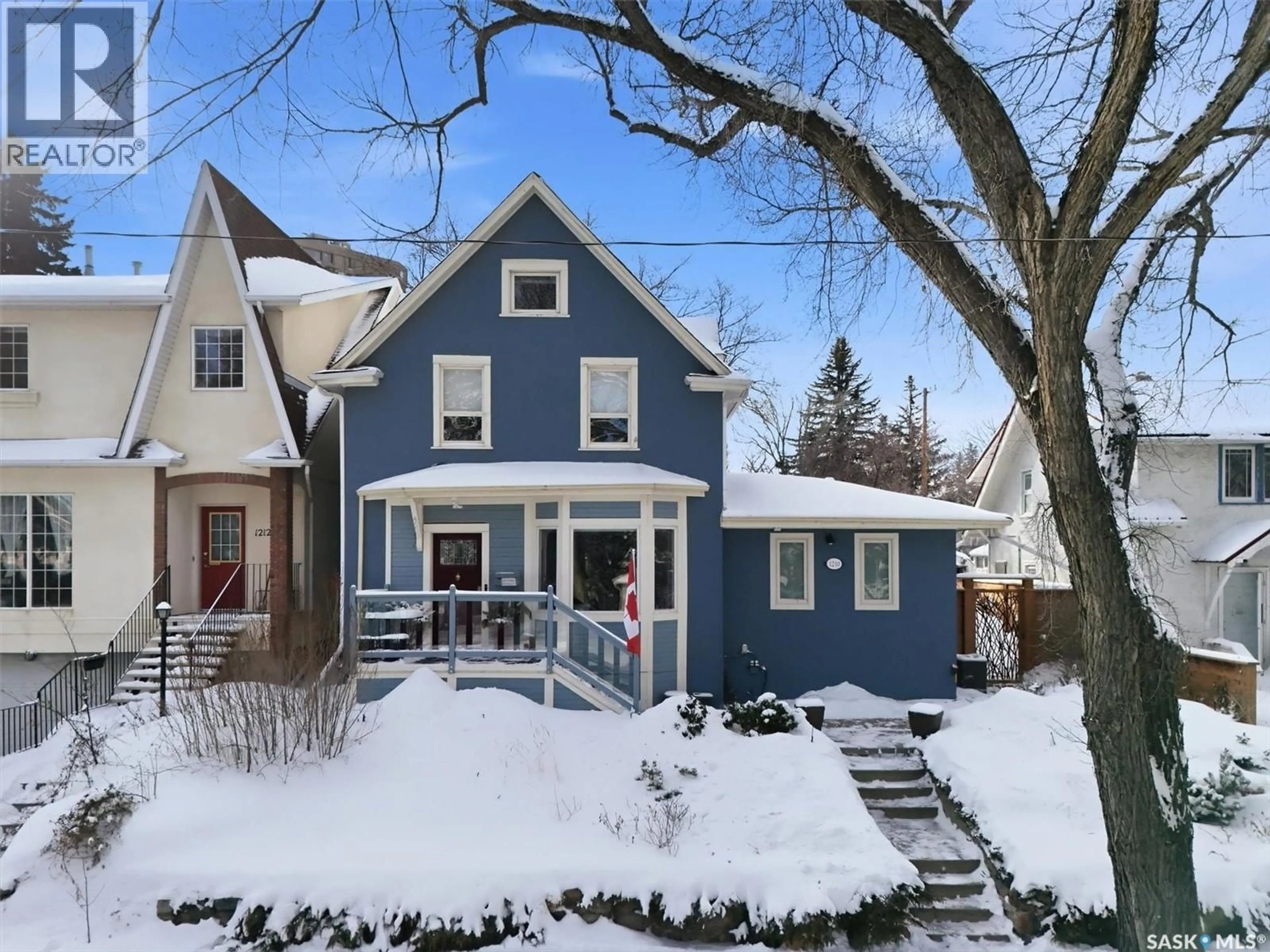 Home with vinyl exterior material, street for 1210 ELLIOTT STREET, Saskatoon Saskatchewan S7N0V6