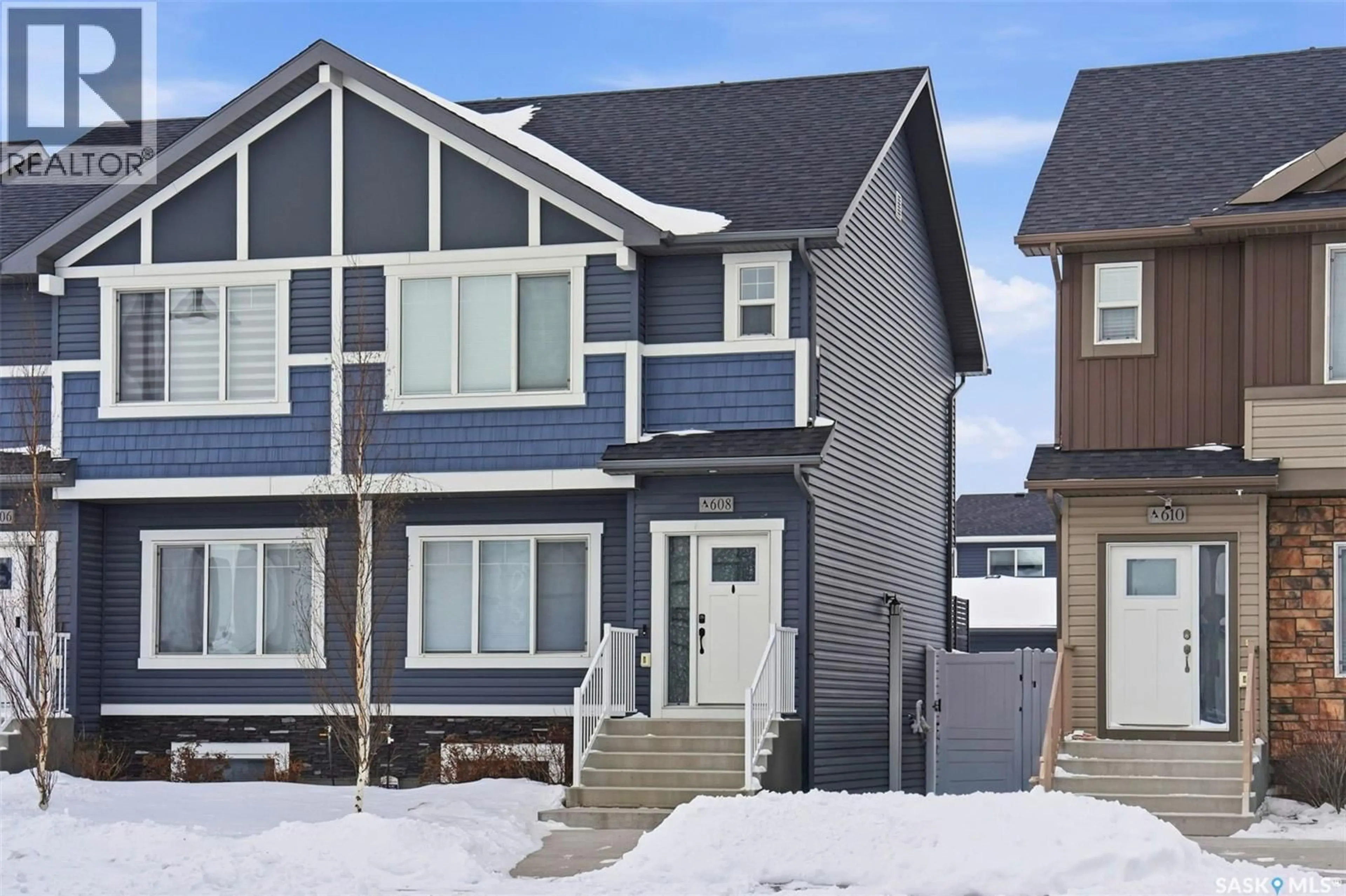 Home with vinyl exterior material, street for 608 BRIGHTON GATE, Saskatoon Saskatchewan S7V0V5