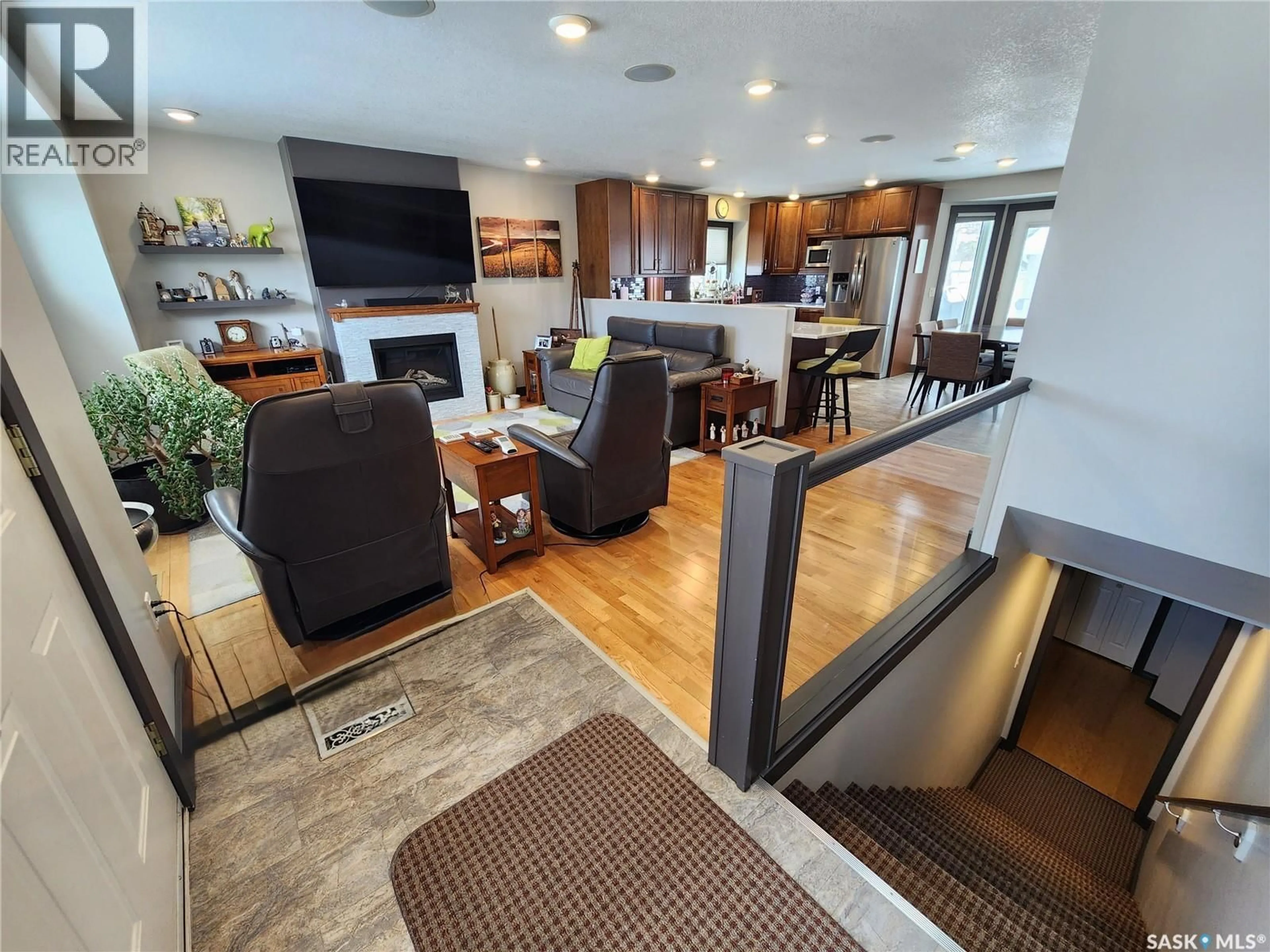 Open concept kitchen, wood/laminate floor for 1194 VETERANS BAY, Estevan Saskatchewan S4A1Z8