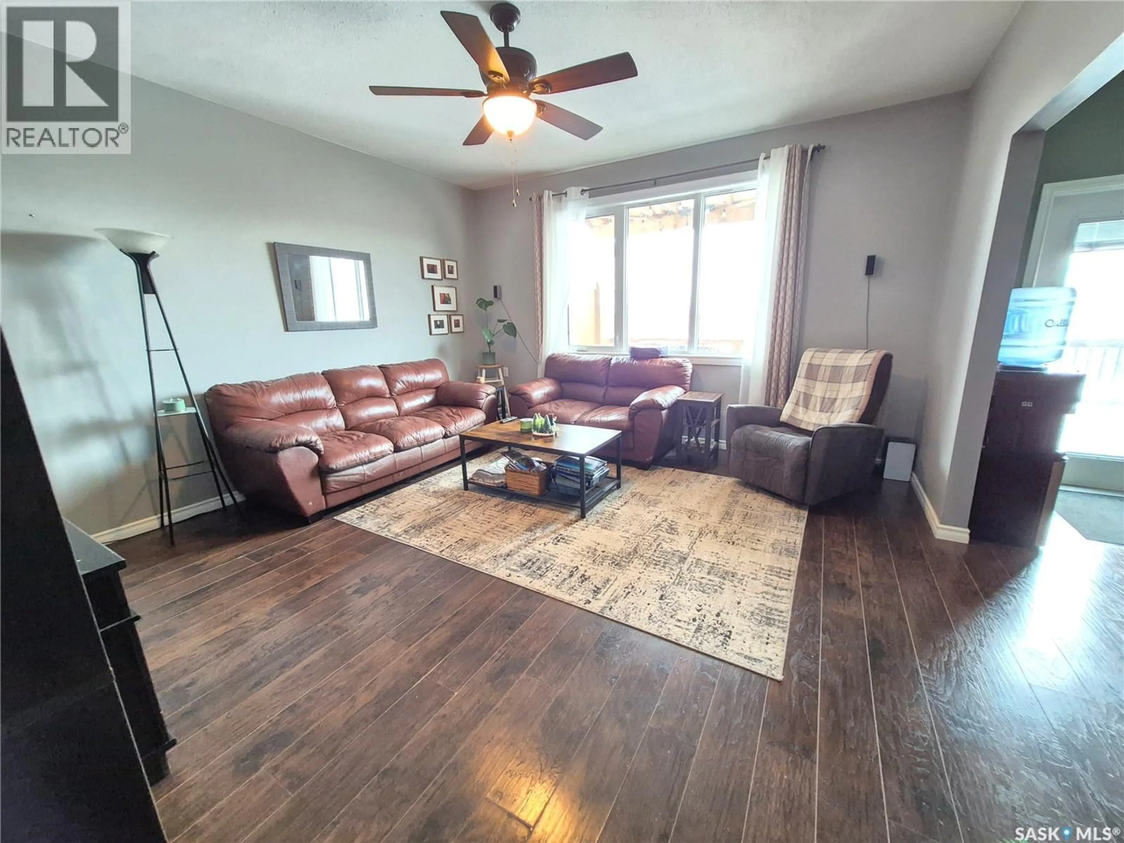 Living room with furniture, wood/laminate floor for 208 LOUCKS STREET, Pangman Saskatchewan S0C2C0