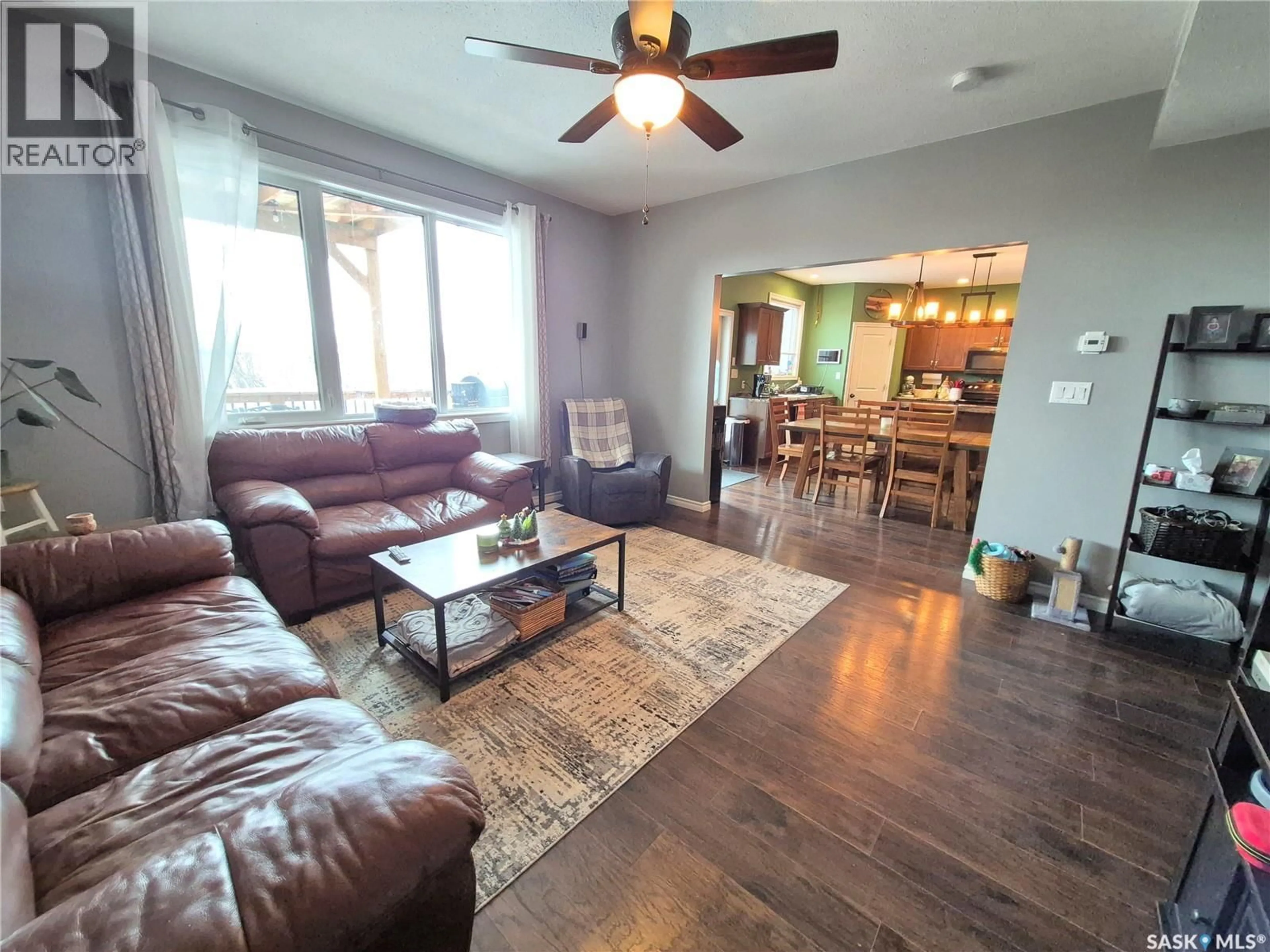 Living room with furniture, wood/laminate floor for 208 LOUCKS STREET, Pangman Saskatchewan S0C2C0