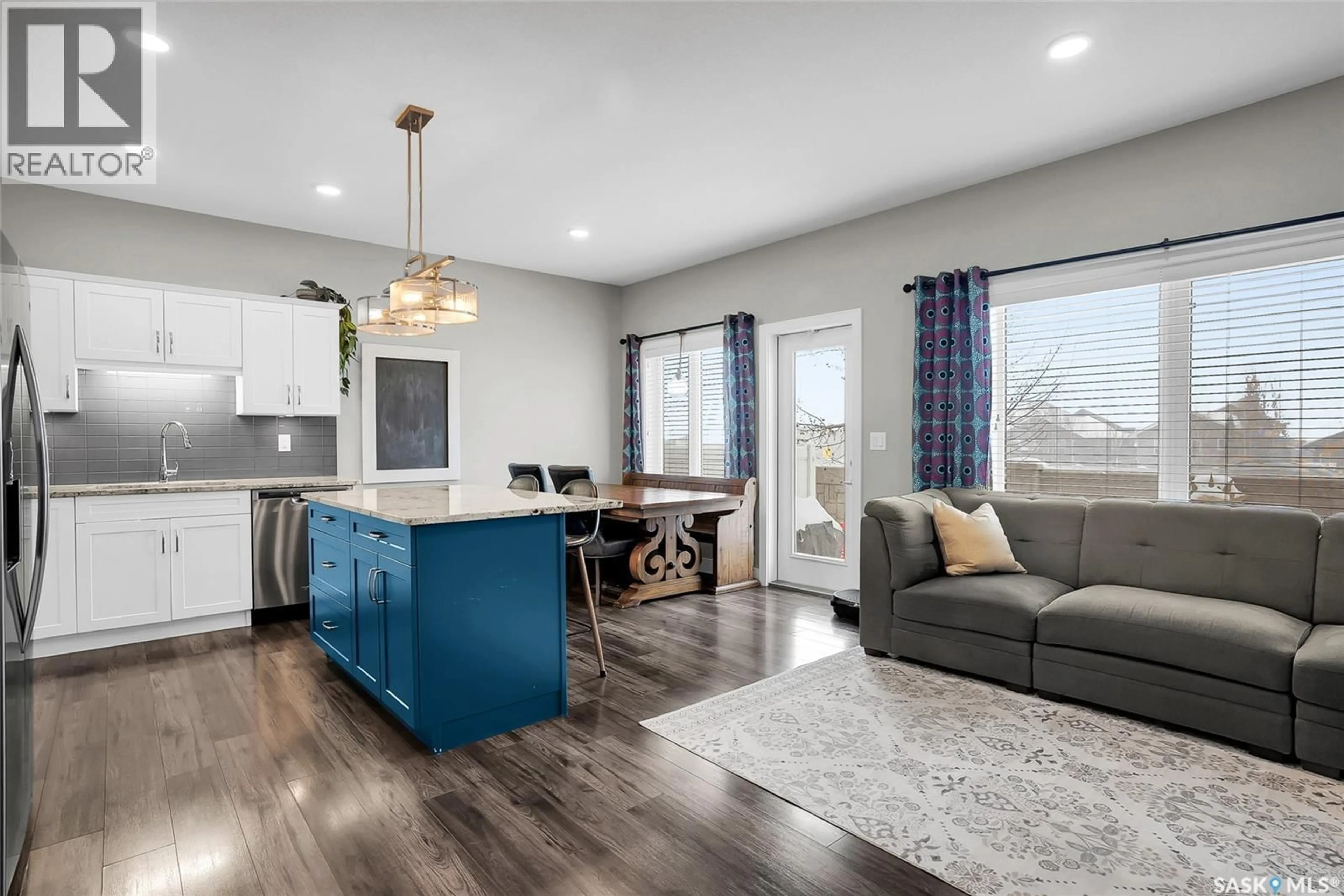 Open concept kitchen, wood/laminate floor for 22 115 VELTKAMP CRESCENT, Saskatoon Saskatchewan S7T0T7