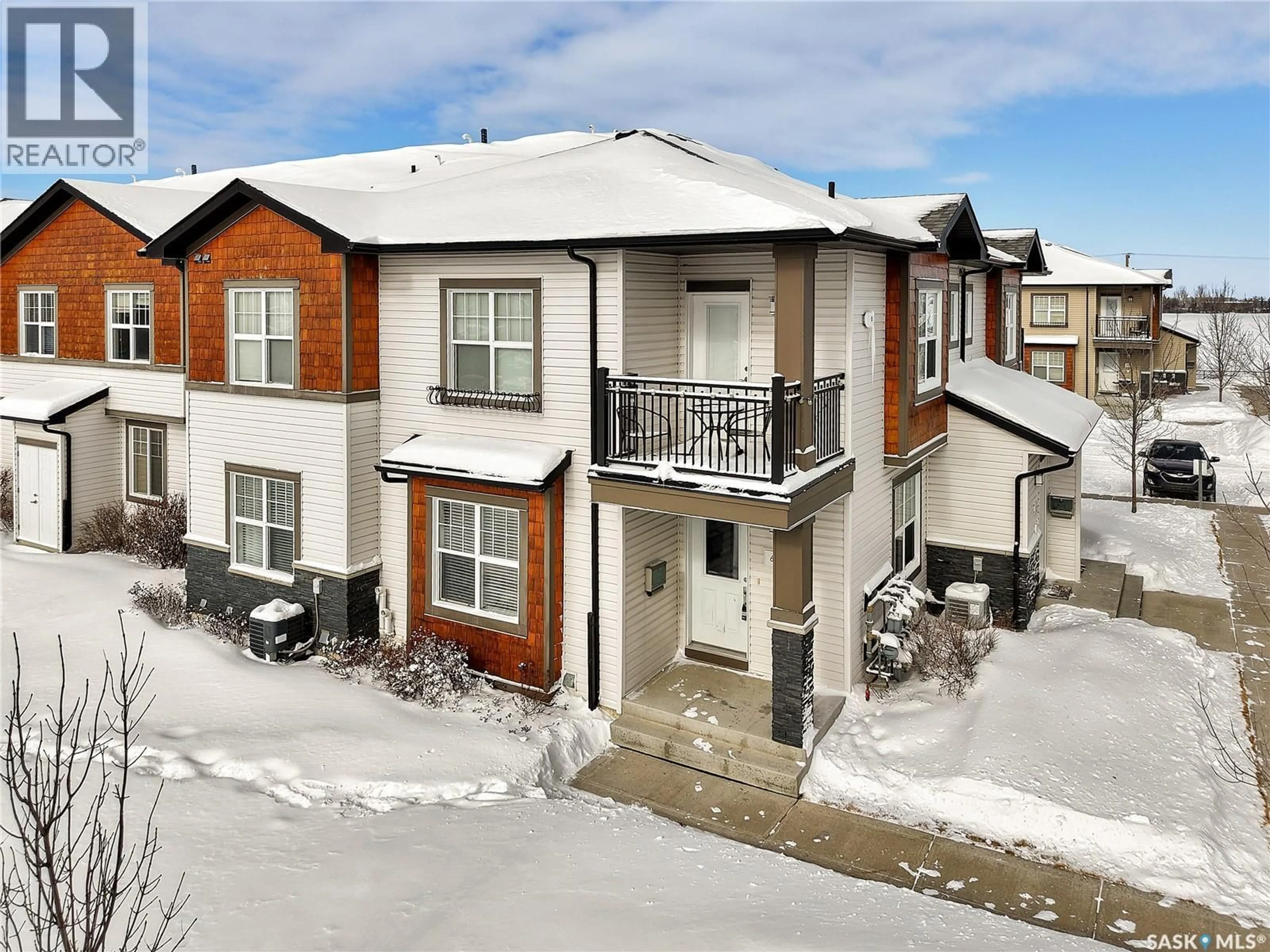 A pic from outside/outdoor area/front of a property/back of a property/a pic from drone, street for 1015 - 611 PATRICK CRESCENT, Saskatoon Saskatchewan S7W0N3