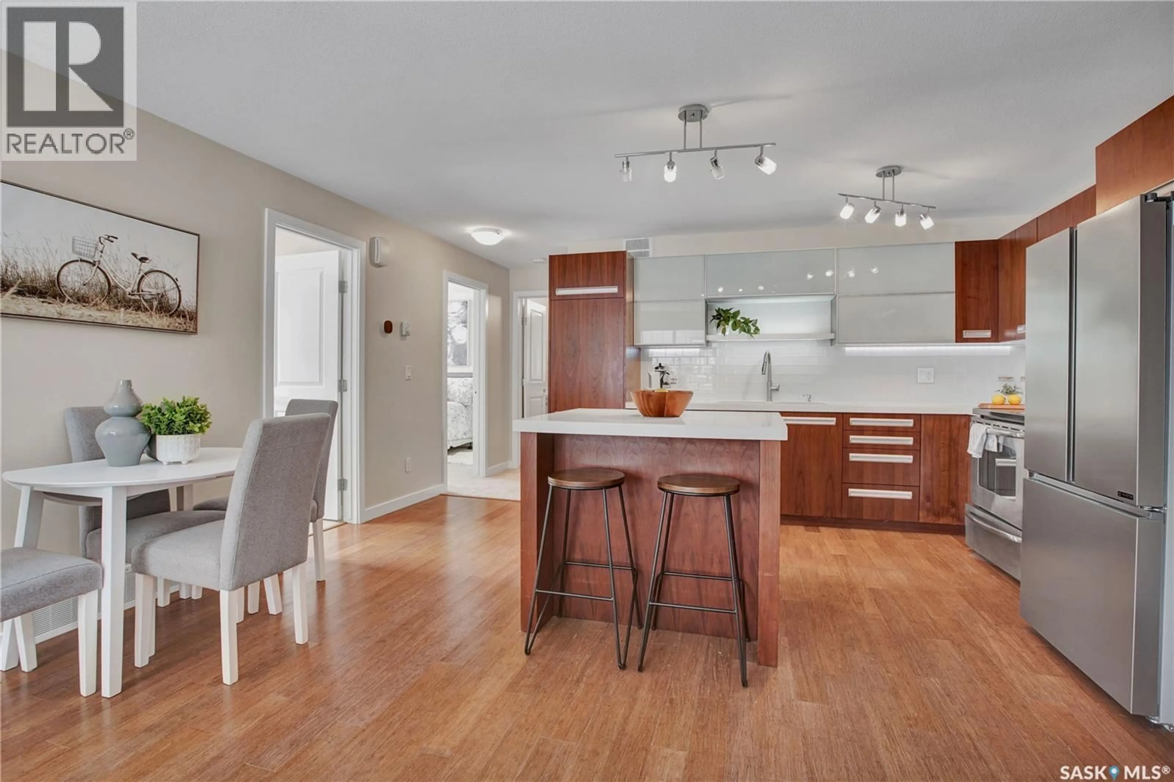 Open concept kitchen, wood/laminate floor for 1015 - 611 PATRICK CRESCENT, Saskatoon Saskatchewan S7W0N3