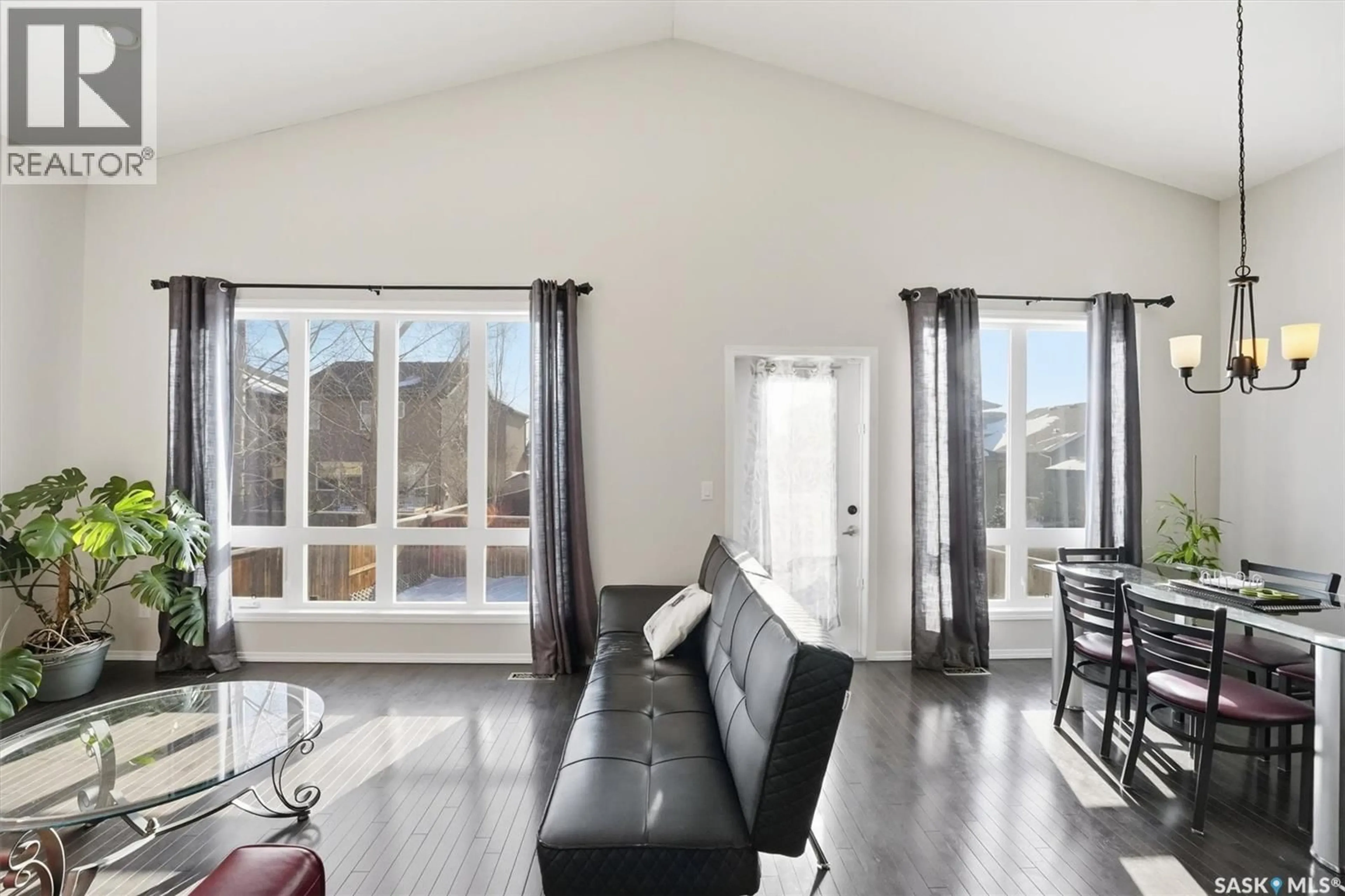 Living room with furniture, wood/laminate floor for 1018 REMPEL WAY, Saskatoon Saskatchewan S7T0M6