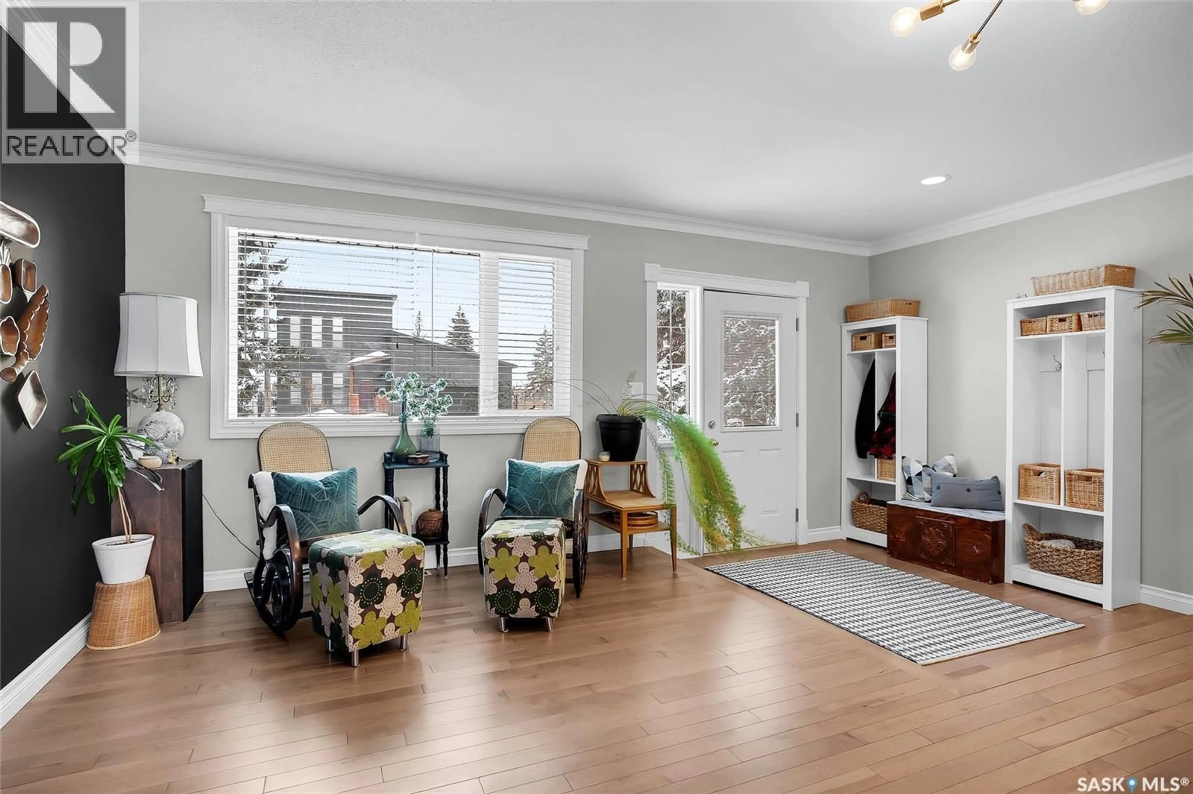 Living room with furniture, wood/laminate floor for 111 NORMAN AVENUE, Aberdeen Saskatchewan S0K0A0