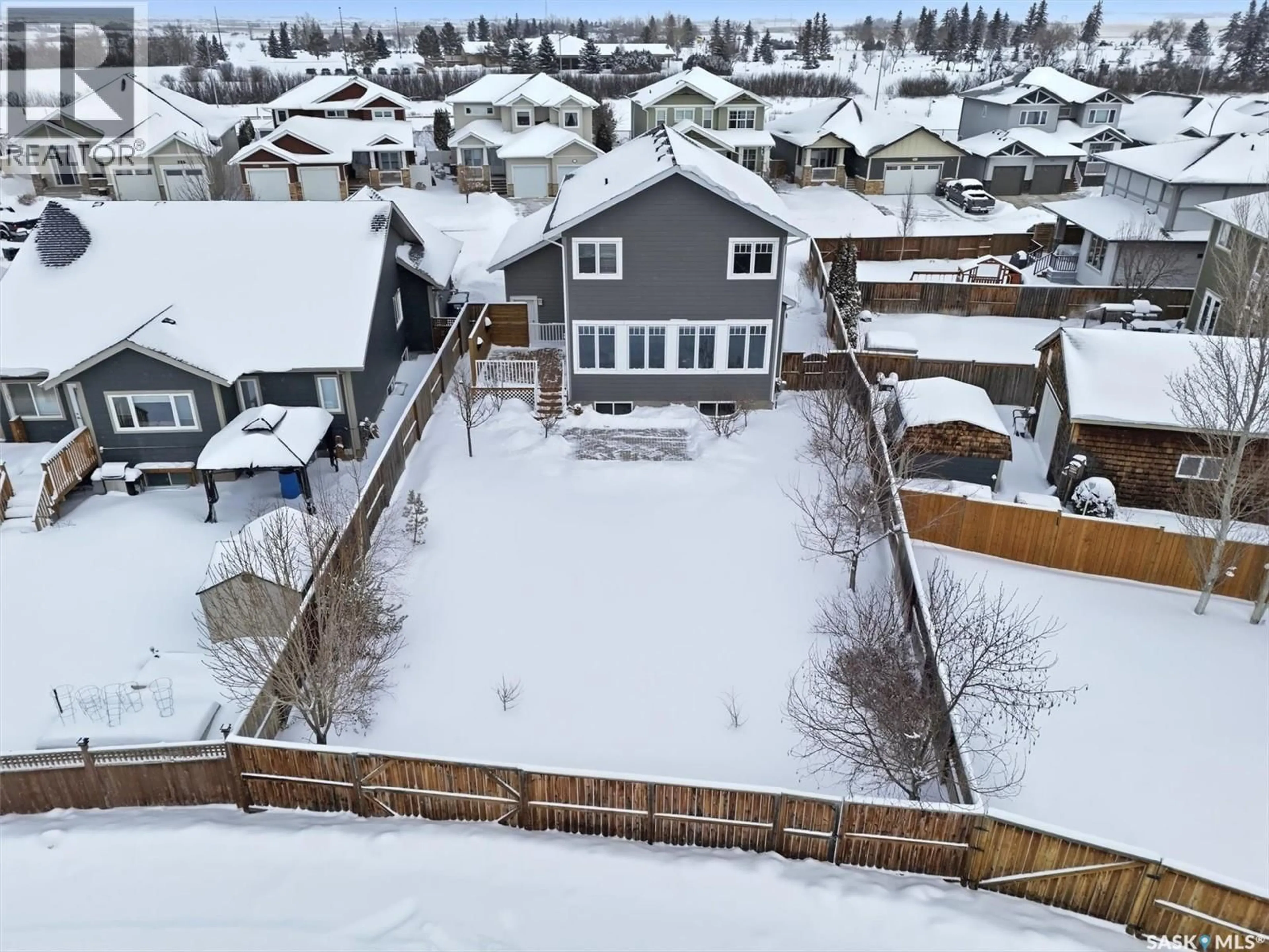 A pic from outside/outdoor area/front of a property/back of a property/a pic from drone, unknown for 203 PRITCHARD TERRACE, Saskatoon Saskatchewan S7V0E9