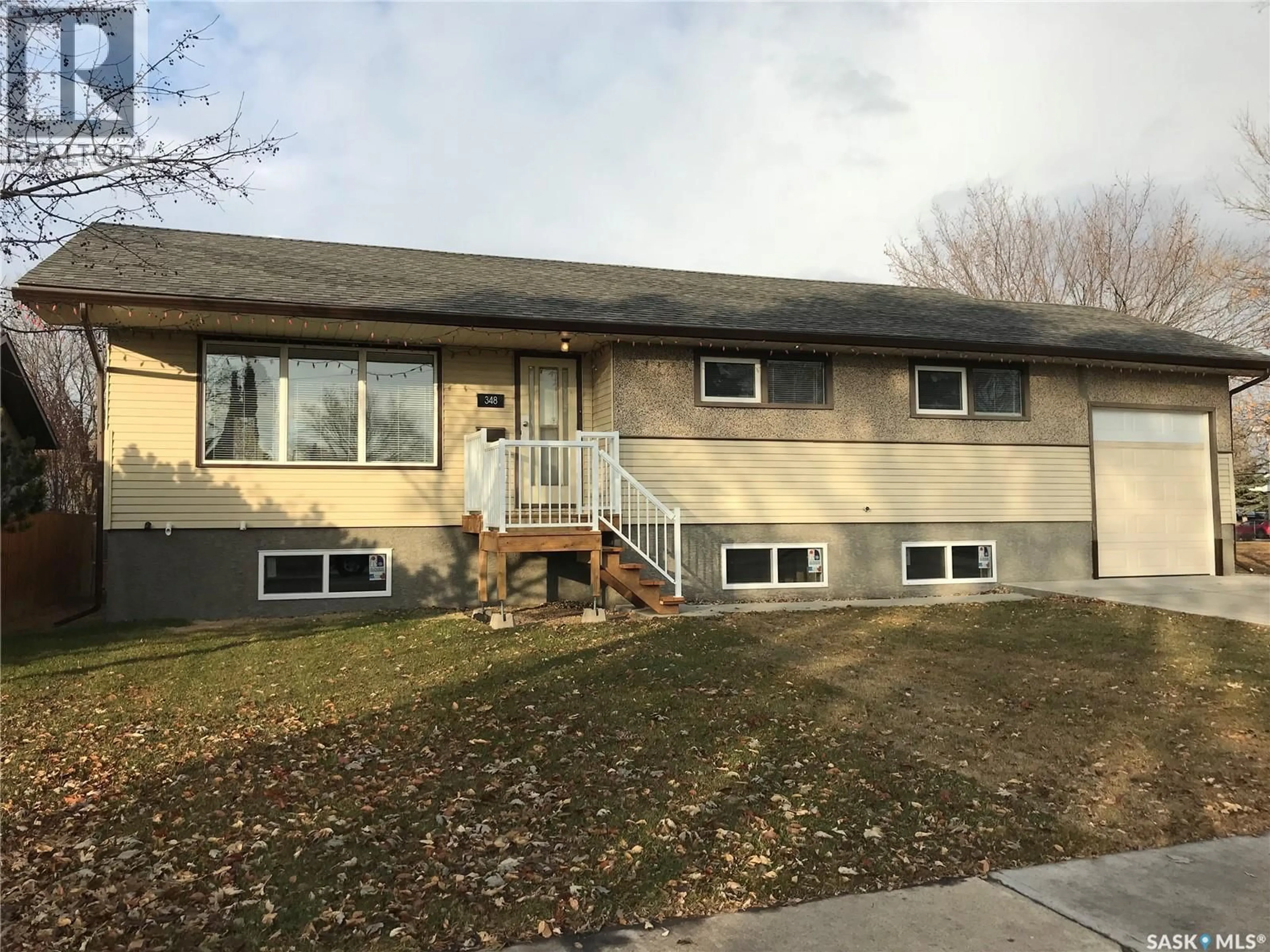Home with vinyl exterior material, street for 348 27TH STREET, Prince Albert Saskatchewan S6V4S1