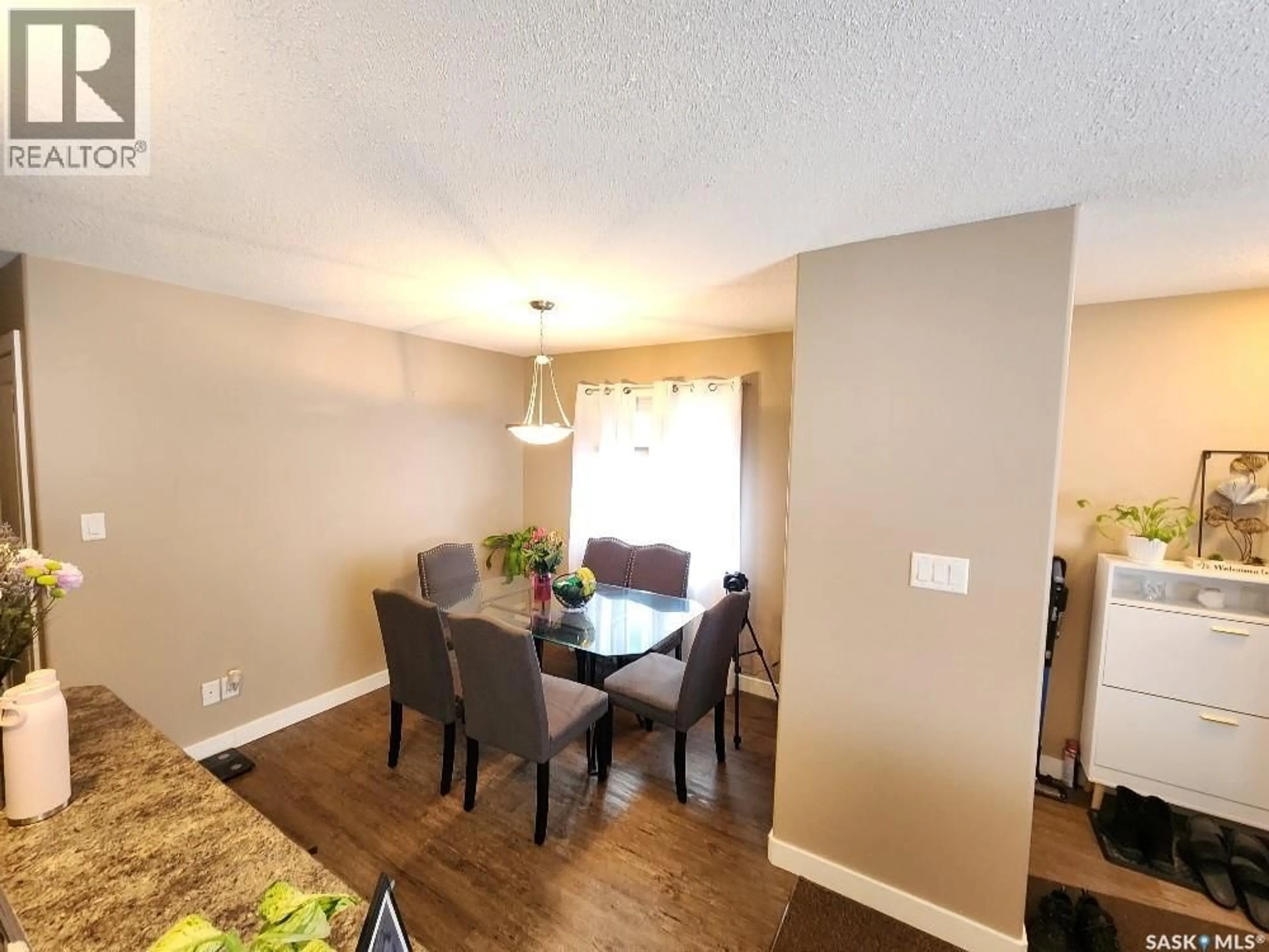 Dining room, wood/laminate floor for 143 ST JOHN STREET, Regina Saskatchewan S4R2V8