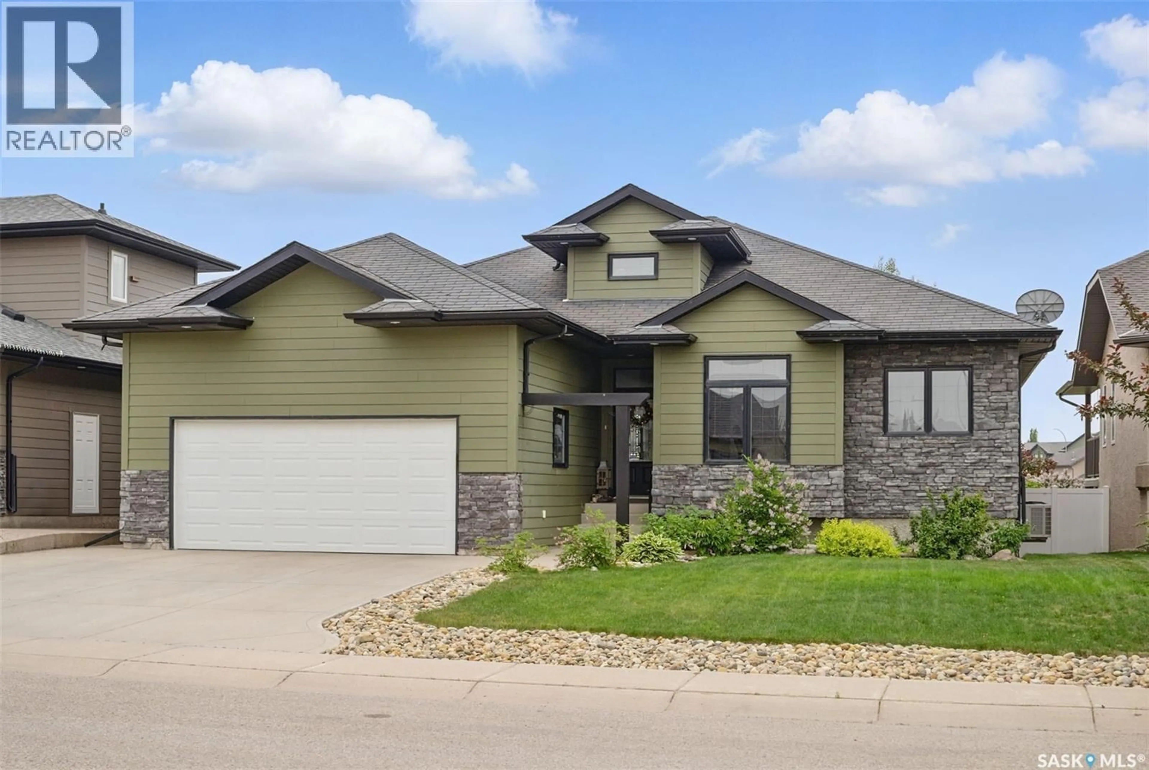 Home with vinyl exterior material, street for 307 BROOKSIDE DRIVE, Warman Saskatchewan S0K0A1