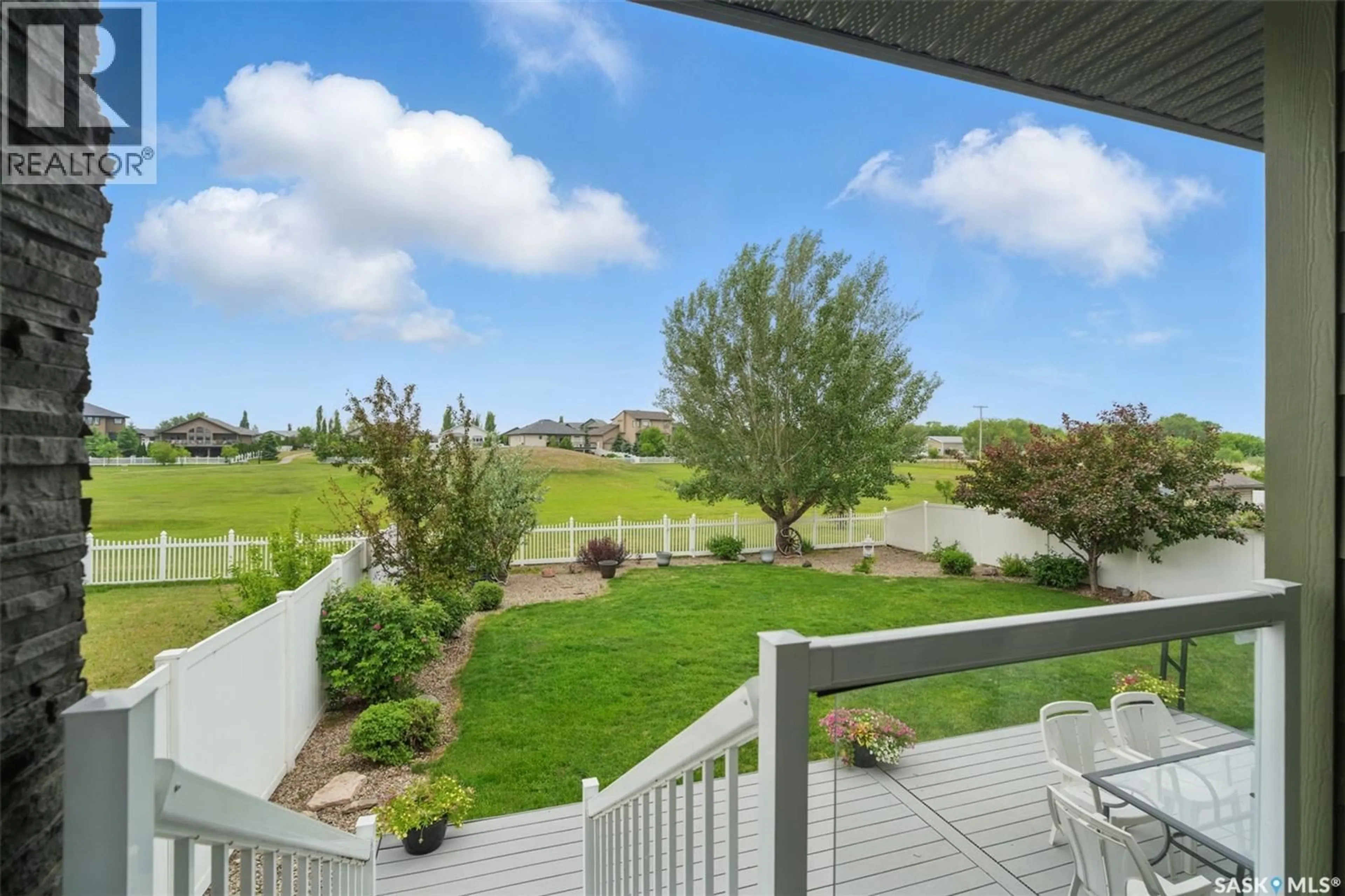 Patio, water/lake/river/ocean view for 307 BROOKSIDE DRIVE, Warman Saskatchewan S0K0A1