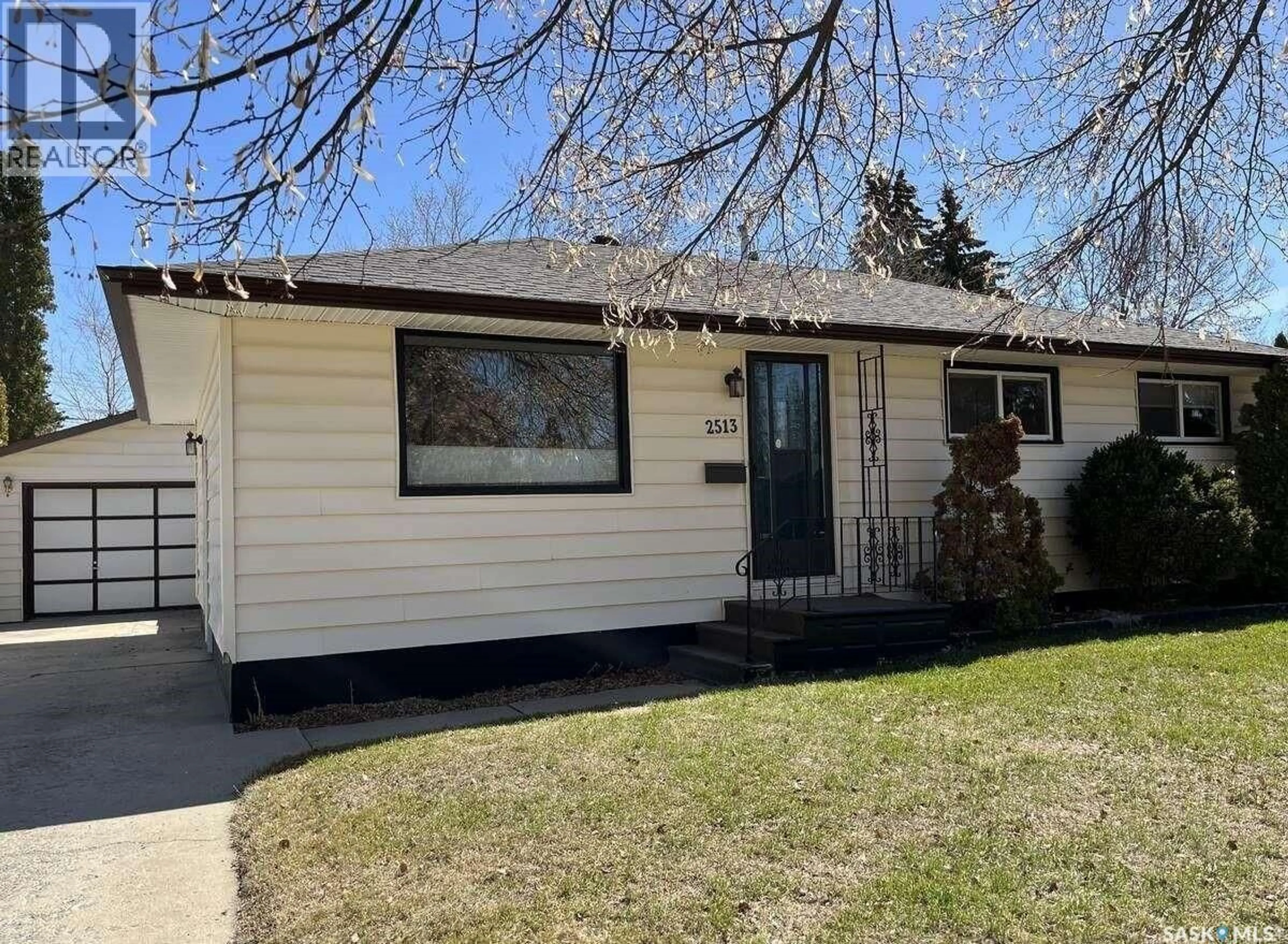Home with vinyl exterior material, street for 2513 CAIRNS AVENUE, Saskatoon Saskatchewan S7J1V4