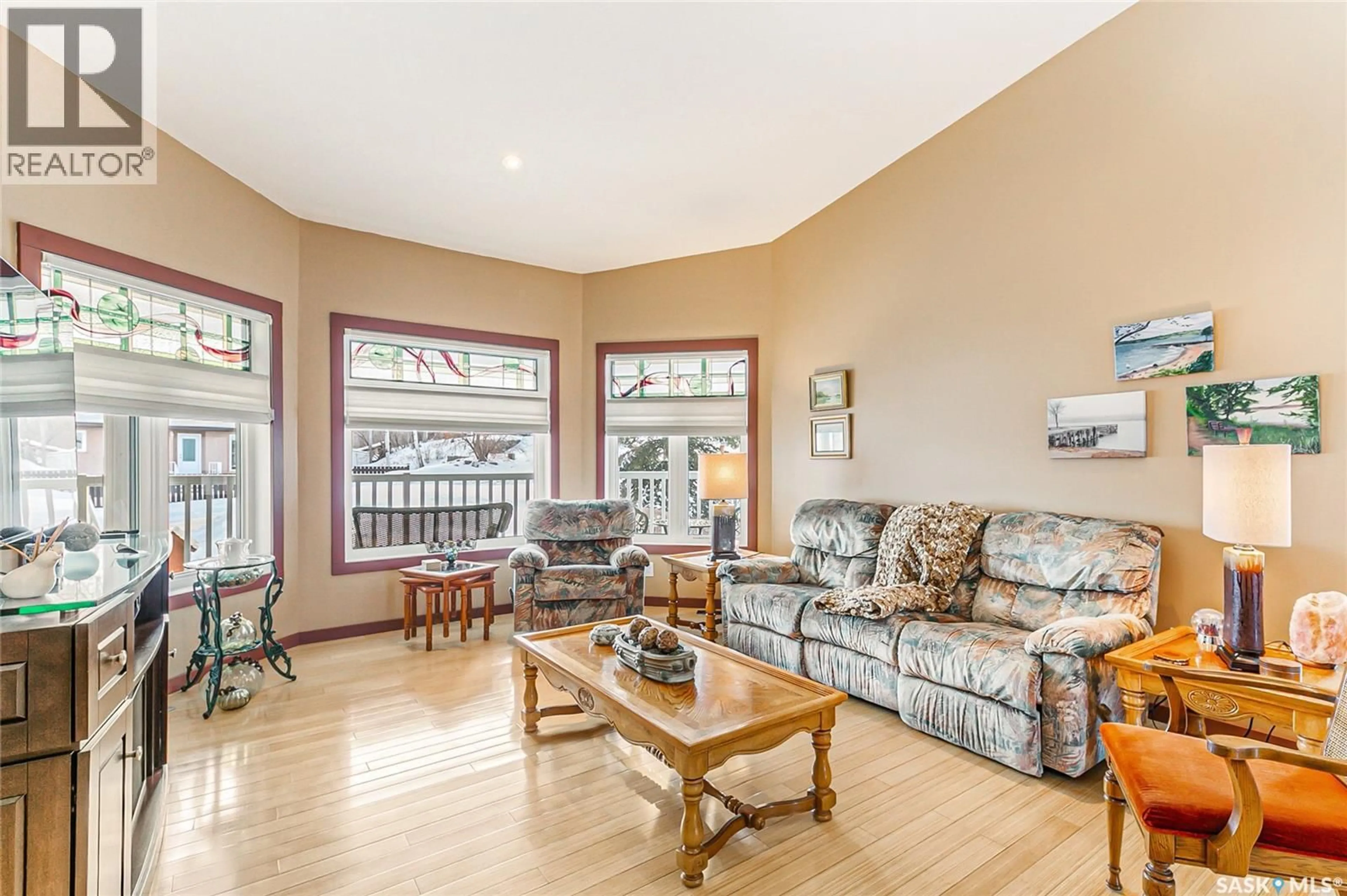 Living room with furniture, wood/laminate floor for 520 9TH STREET, Regina Beach Saskatchewan S0G4C0