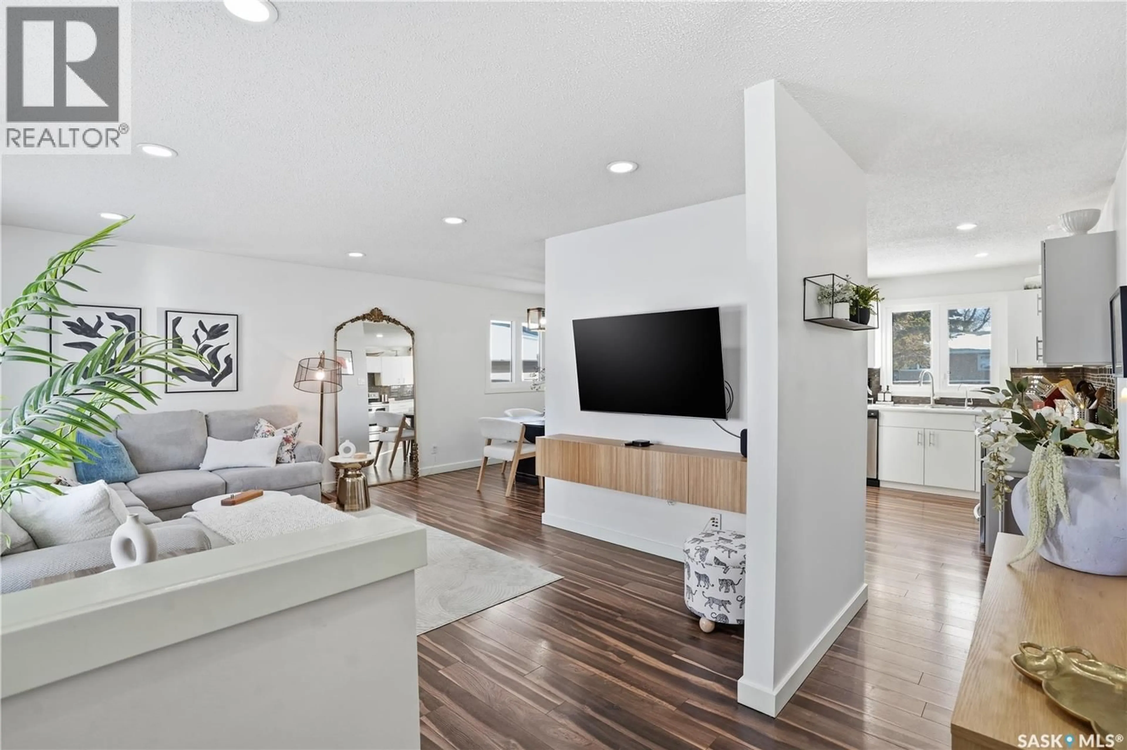 Living room with furniture, wood/laminate floor for 58 JOYCE CRESCENT, Regina Saskatchewan S4N5G3