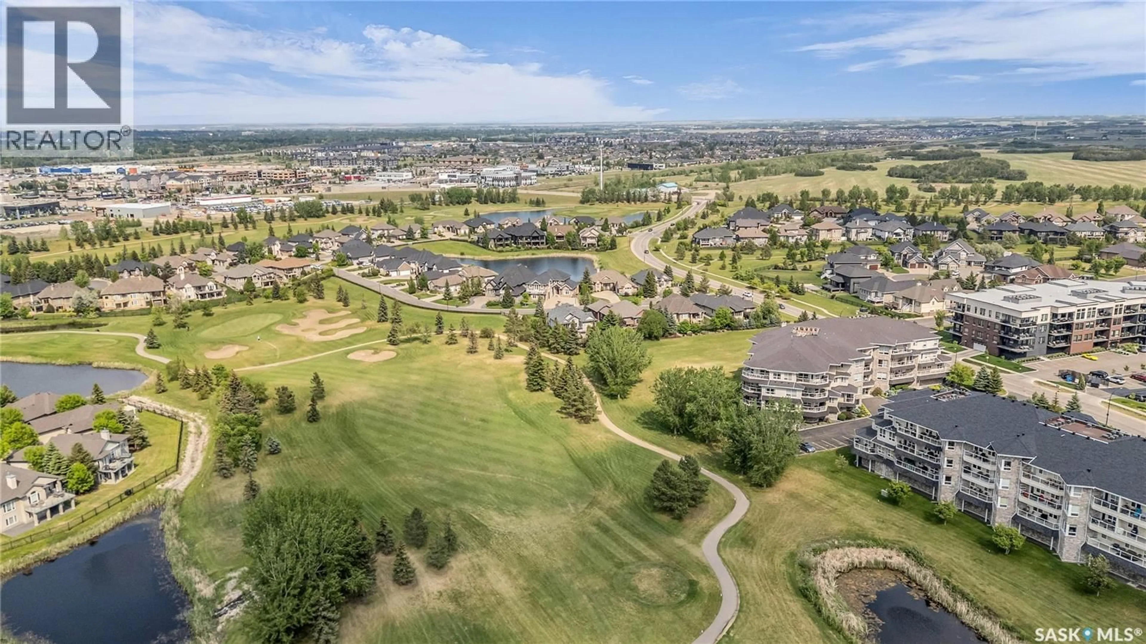 A pic from outside/outdoor area/front of a property/back of a property/a pic from drone, mountain view for 302 - 405 CARTWRIGHT STREET, Saskatoon Saskatchewan S7T0C8