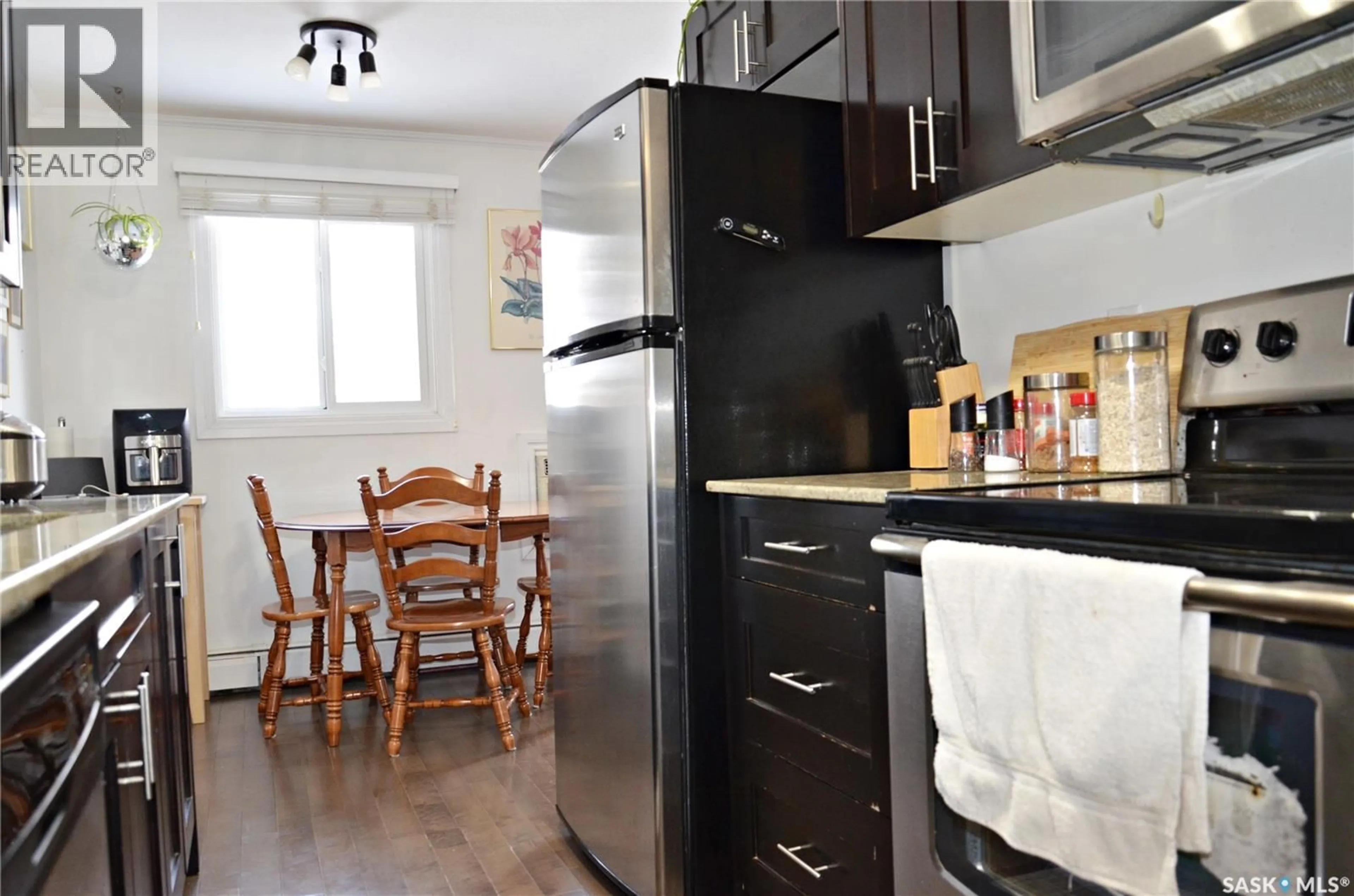 Standard kitchen, wood/laminate floor for E - 301 920 9TH STREET, Saskatoon Saskatchewan S7H0N1