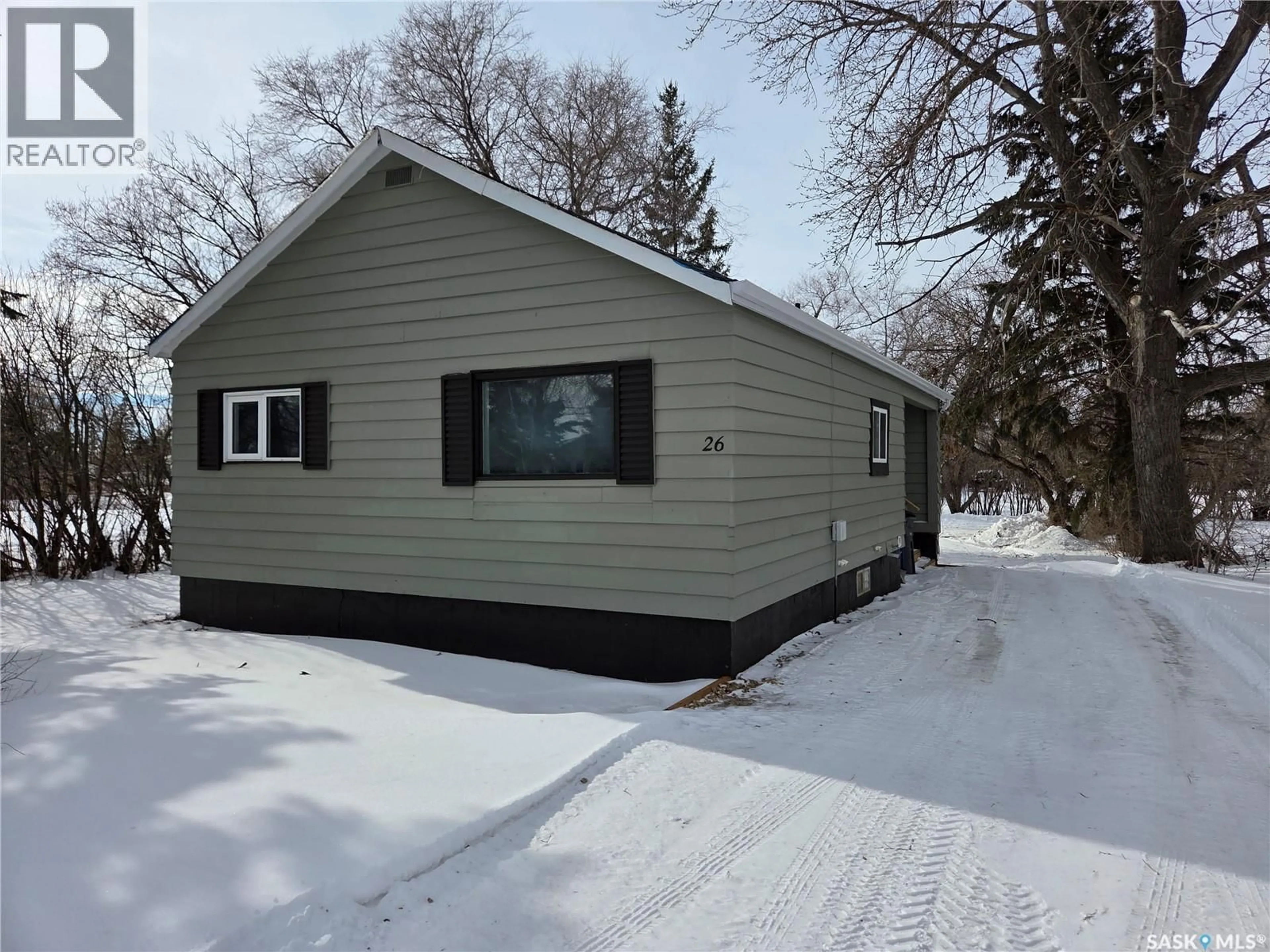 Home with vinyl exterior material, street for 26 FRASER STREET, Manor Saskatchewan S0C1R0