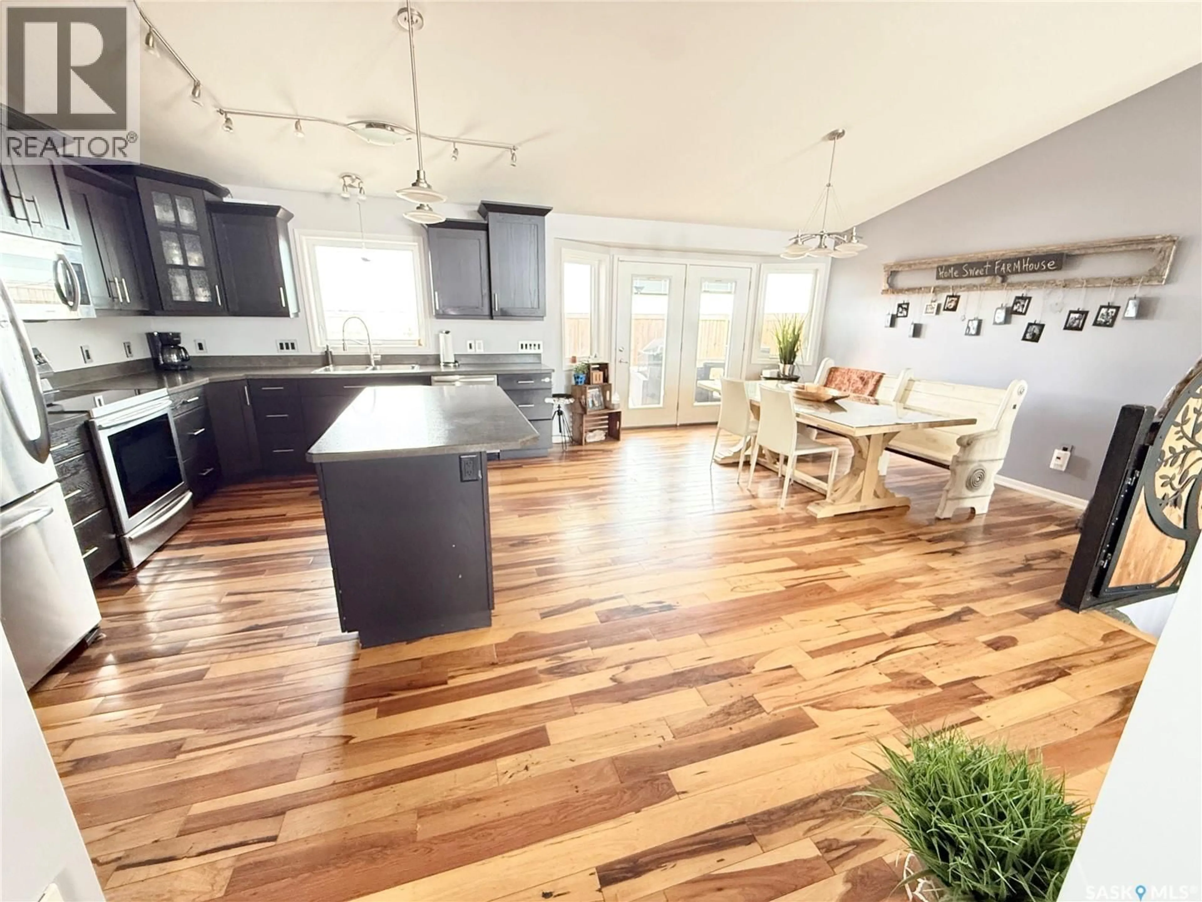 Open concept kitchen, wood/laminate floor for Acreage - 13 WEYBURN HIGHWAY, Weyburn Rm No. 67 Saskatchewan S4H0A0