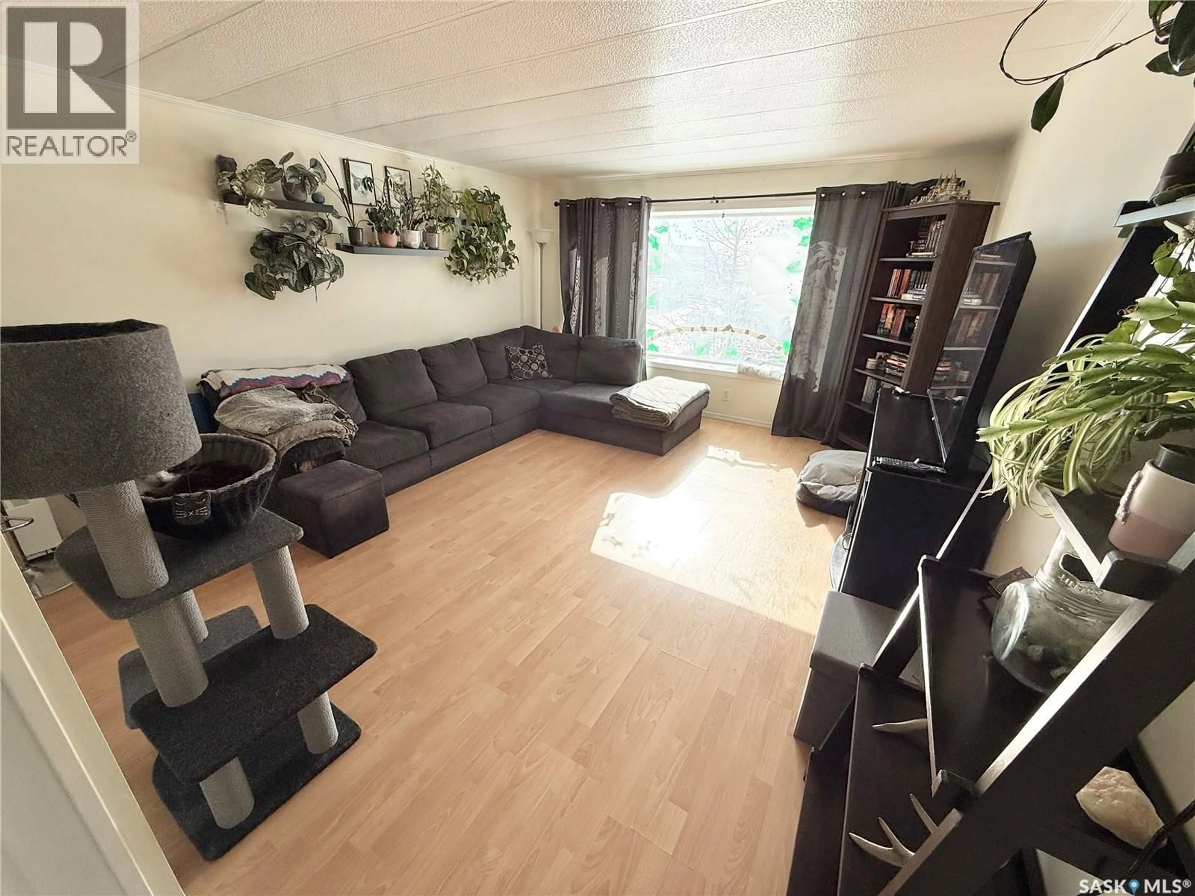 Living room with furniture, unknown for 148 LAING CRESCENT, Weyburn Saskatchewan S4H2R9