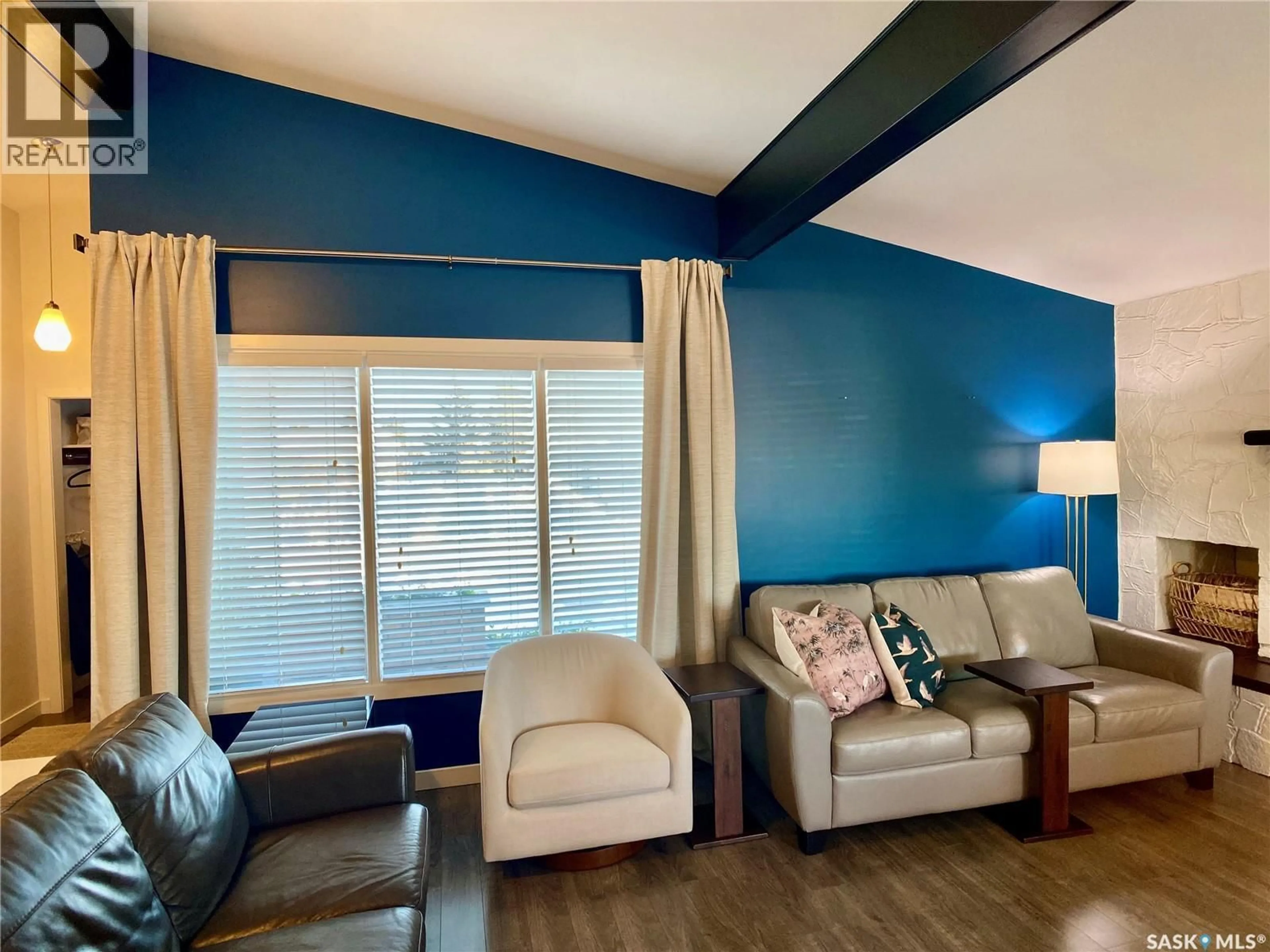 Living room with furniture, wood/laminate floor for 91 MOIR DRIVE, Oxbow Saskatchewan S0C2B0