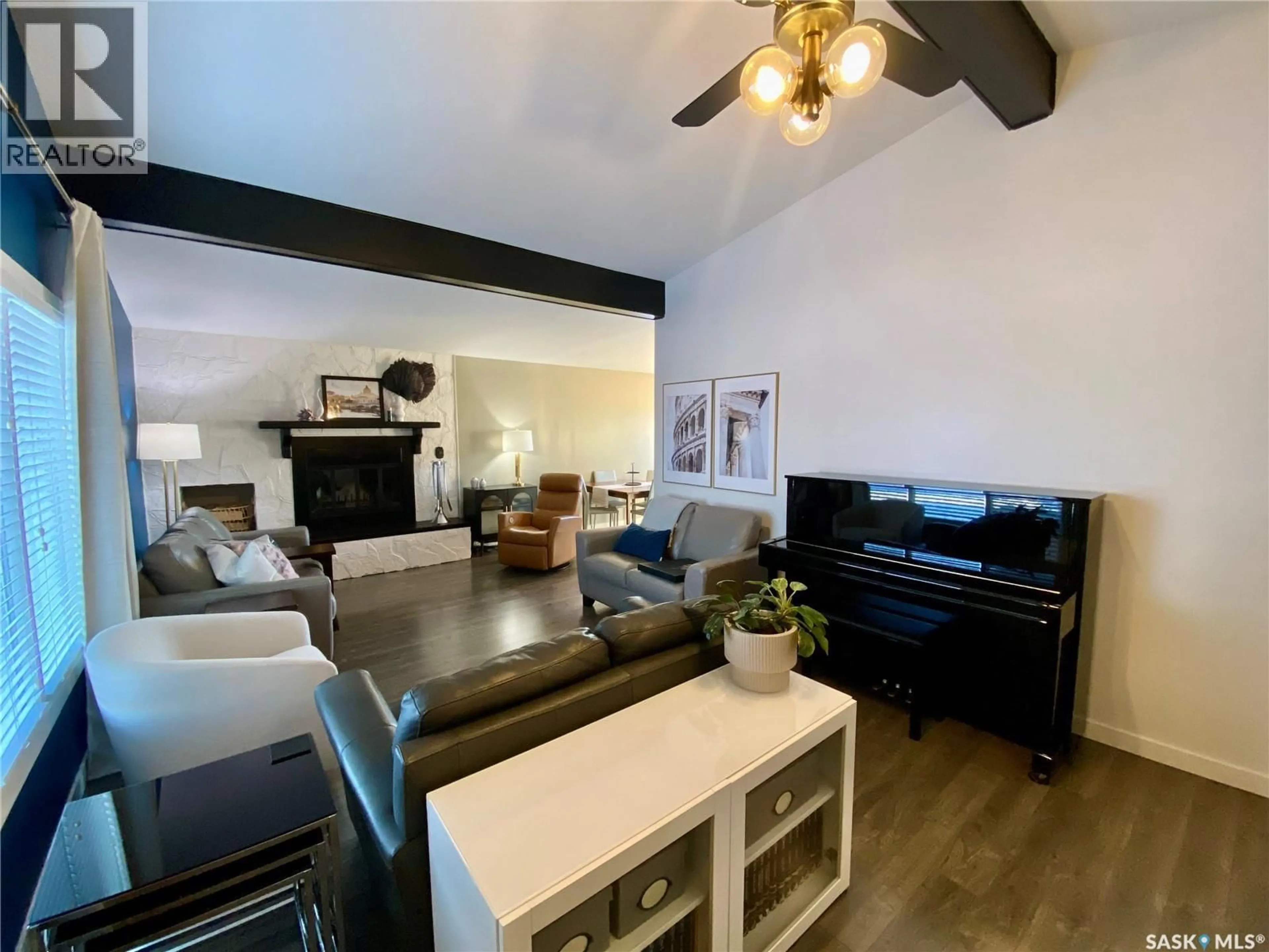 Living room with furniture, wood/laminate floor for 91 MOIR DRIVE, Oxbow Saskatchewan S0C2B0