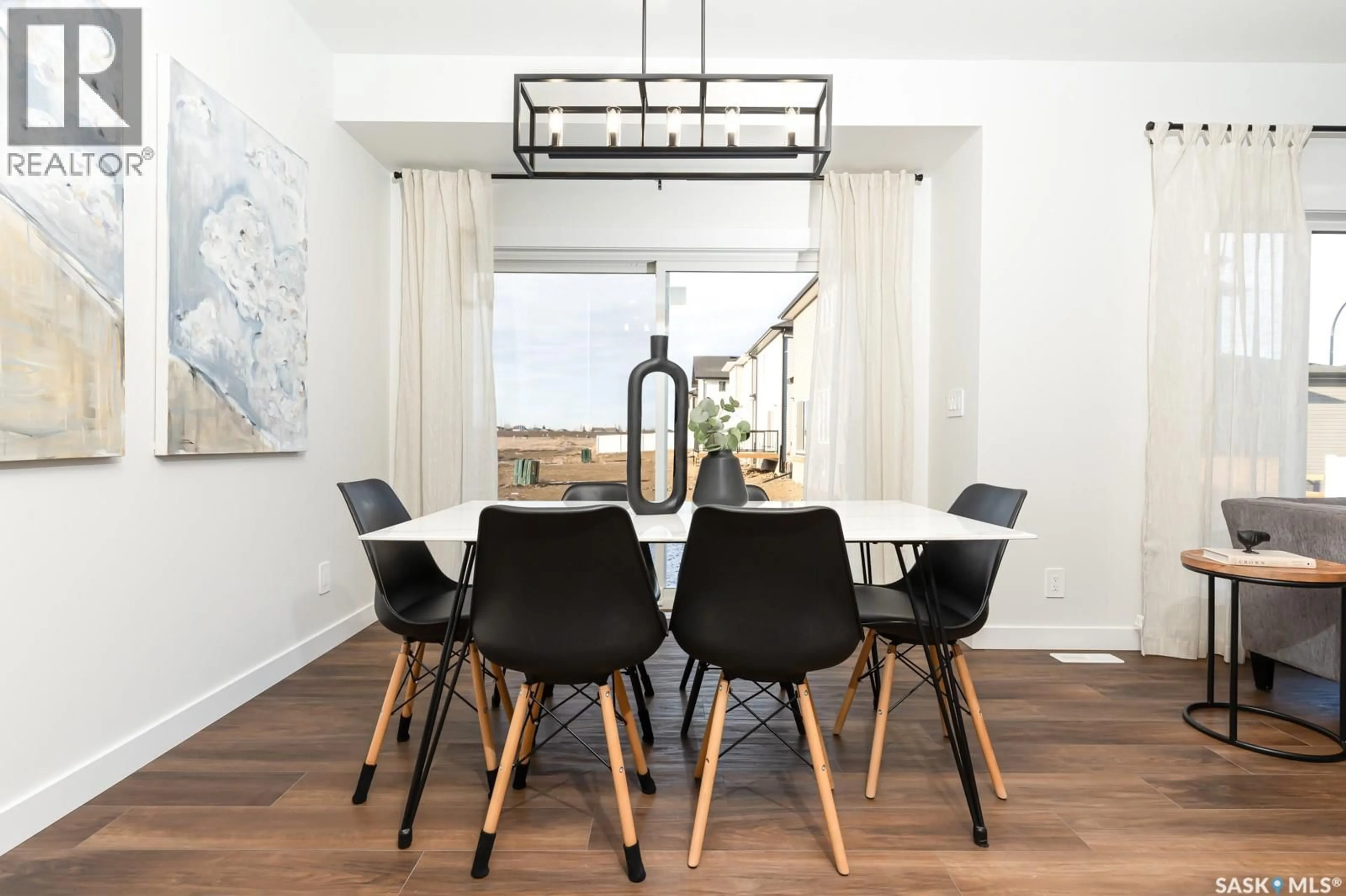 Dining room, wood/laminate floor for 210 DORAN WAY, Saskatoon Saskatchewan S7N4V6