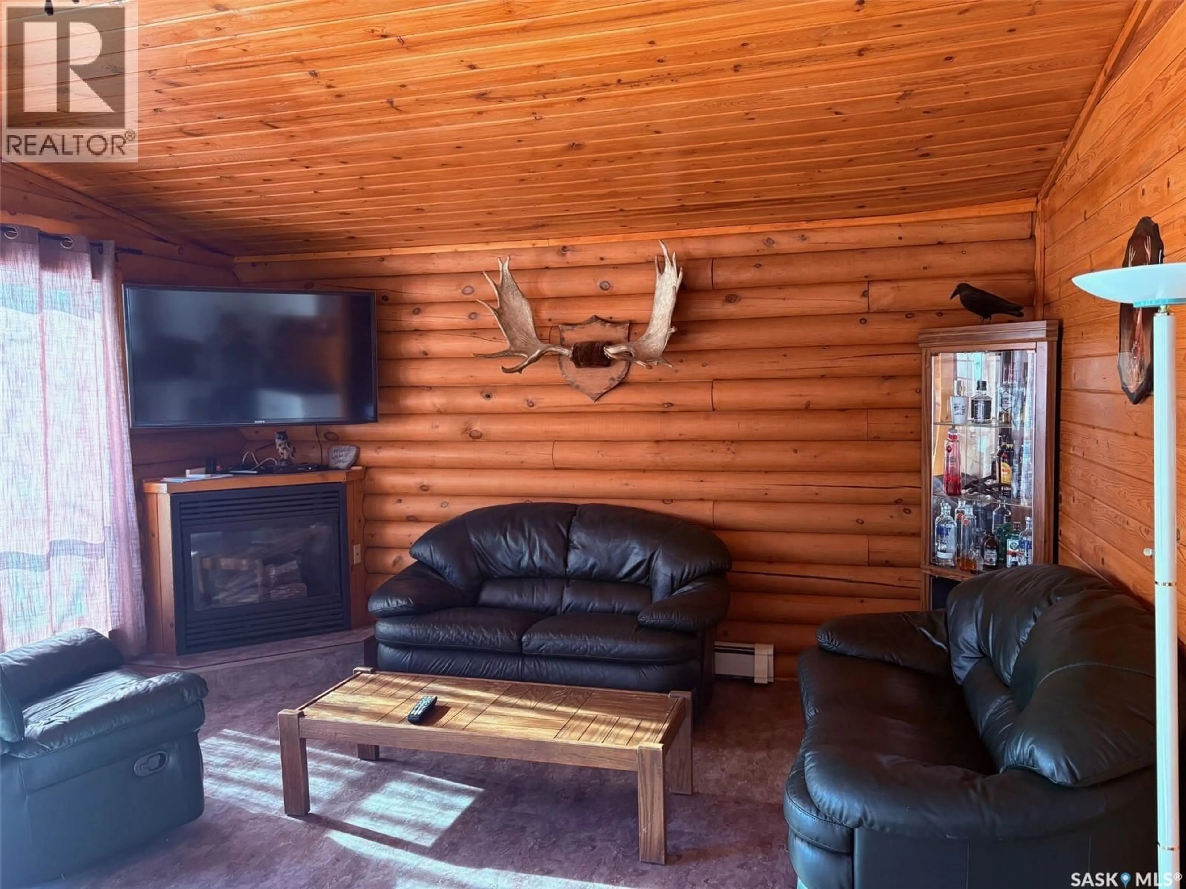 Living room with furniture, wood/laminate floor for 7 SPIRITWOOD LANE, Good Lake Rm No. 274 Saskatchewan S0A0L1