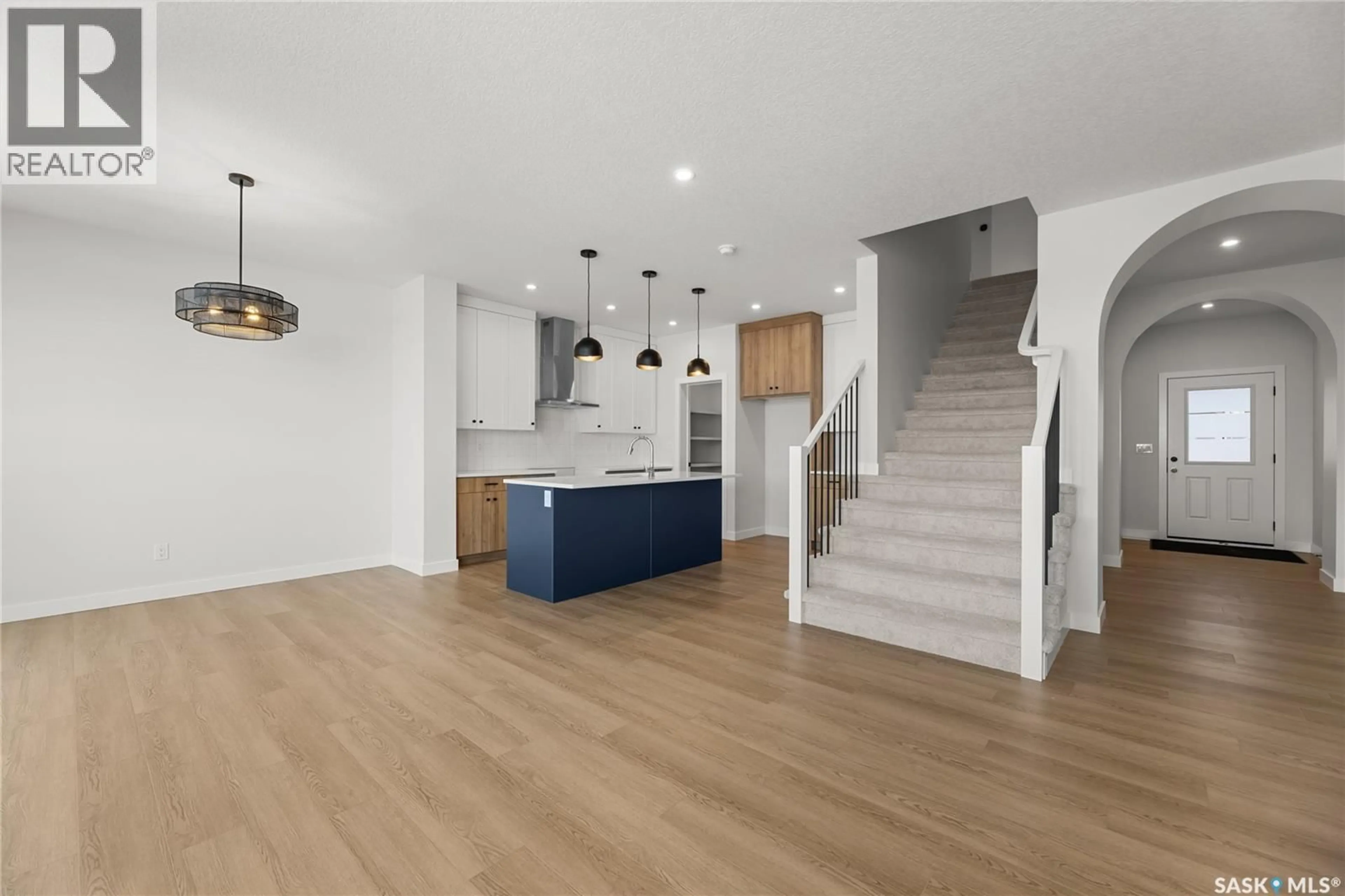 Open concept kitchen, wood/laminate floor for 938 BRIGHTON GATE, Saskatoon Saskatchewan S7V1S6