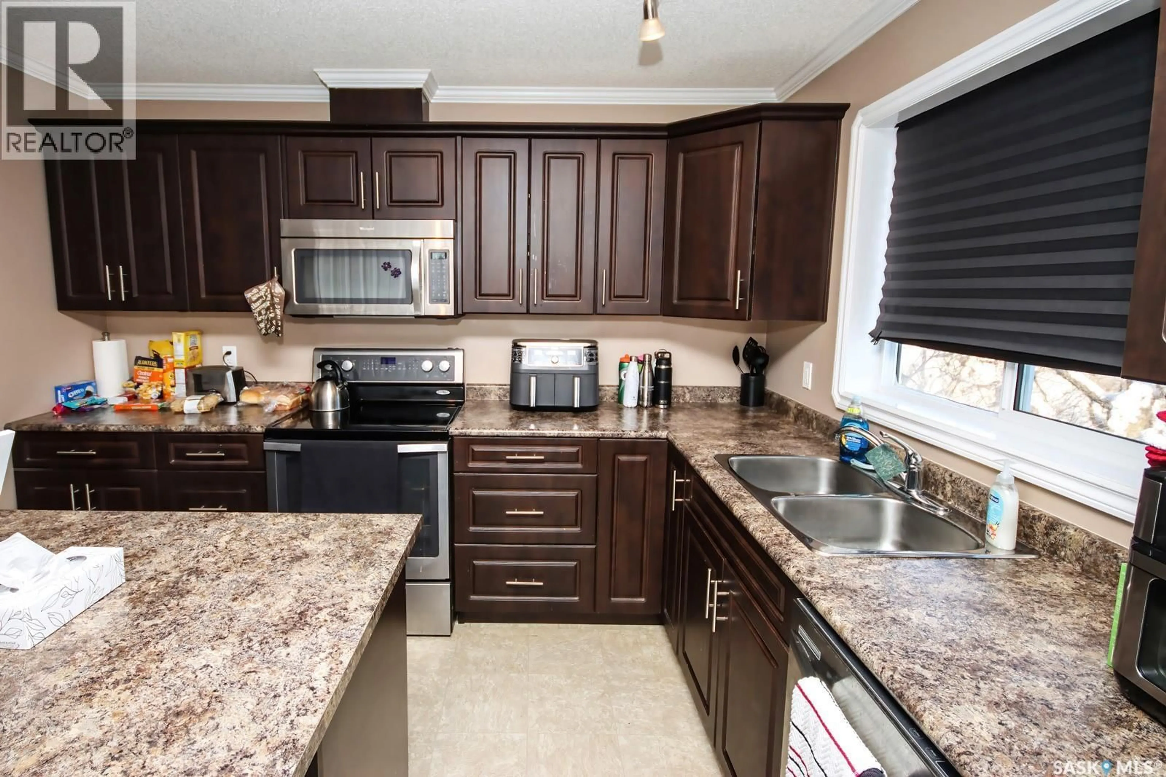 Open concept kitchen, ceramic/tile floor for 1805 3RD STREET, Estevan Saskatchewan S4A0T1