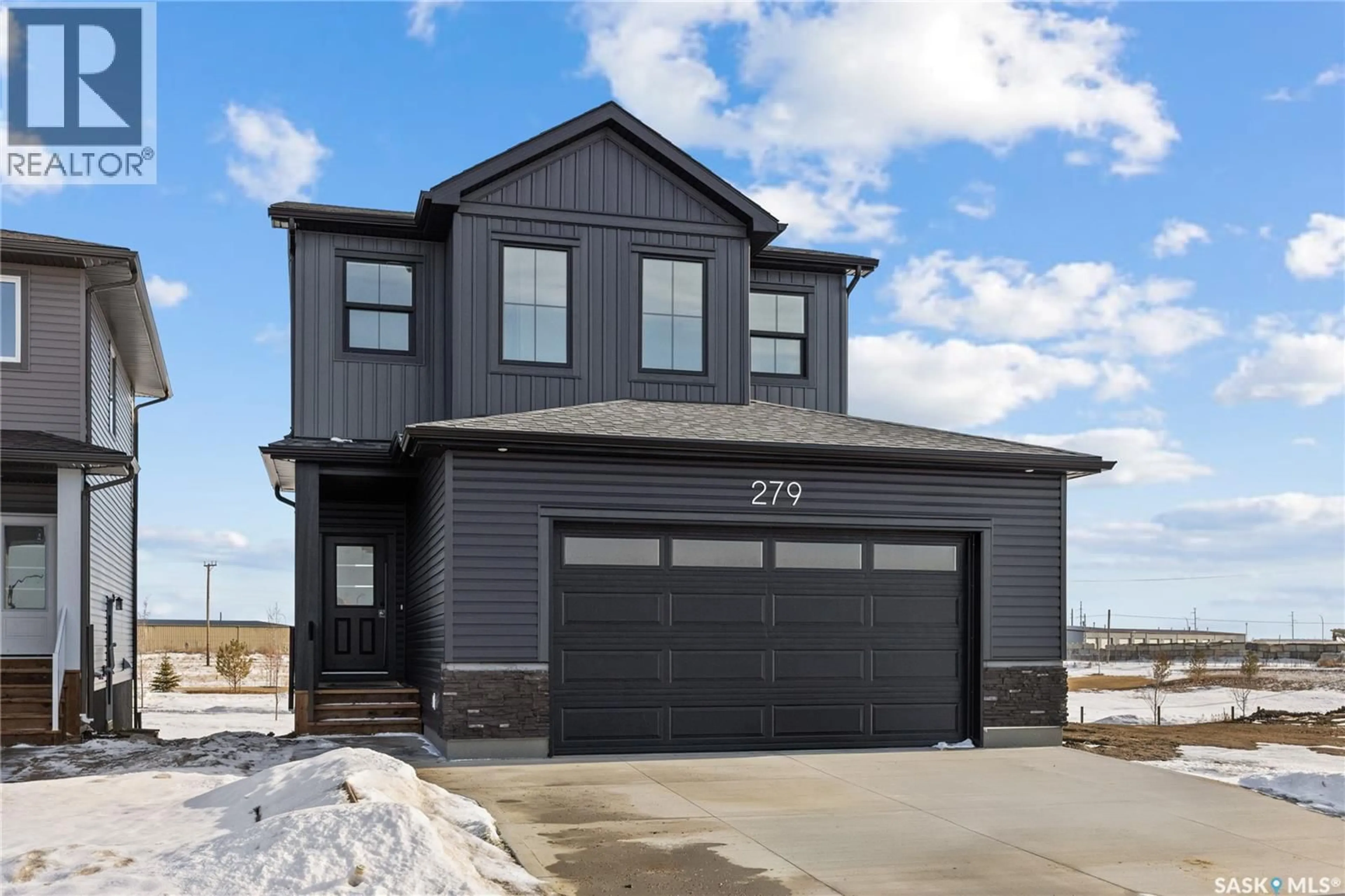 Home with vinyl exterior material, street for 279 NAZARALI WAY, Saskatoon Saskatchewan S7V1X6