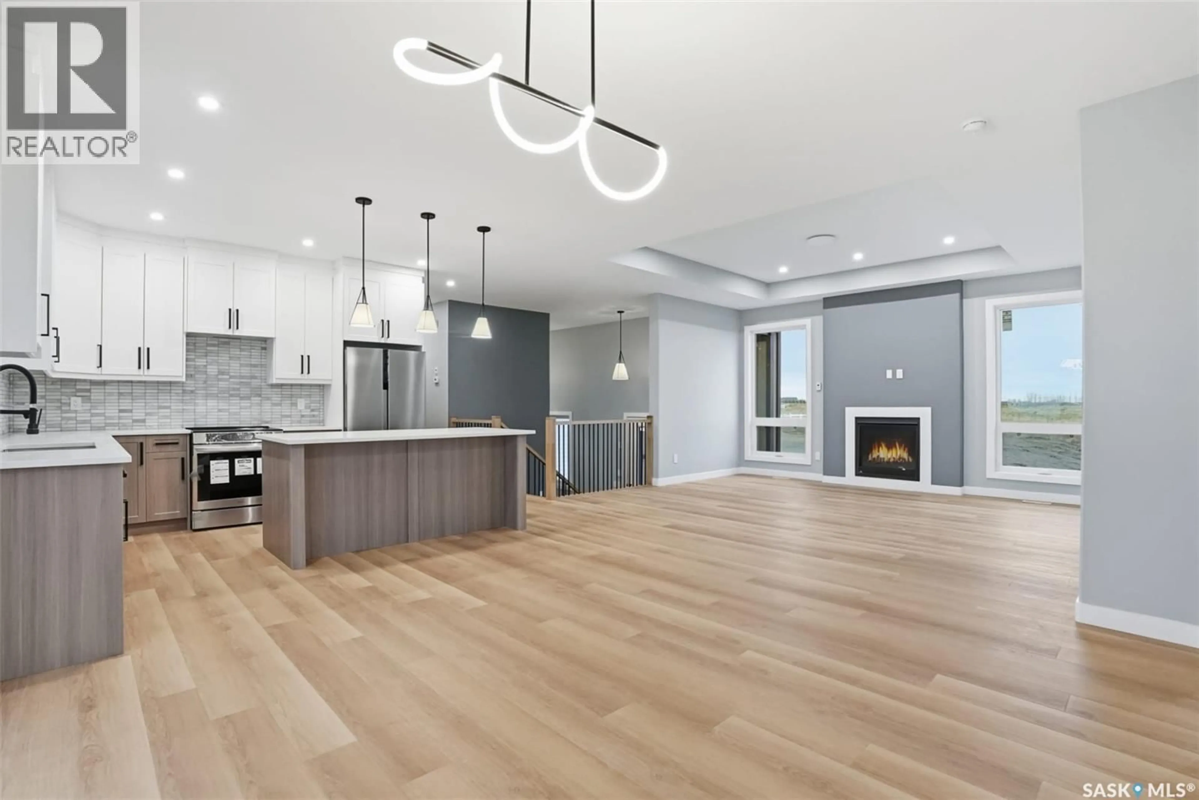 Open concept kitchen, wood/laminate floor for 8 CARDINAL DRIVE, Dundurn Rm No. 314 Saskatchewan S7C0C3