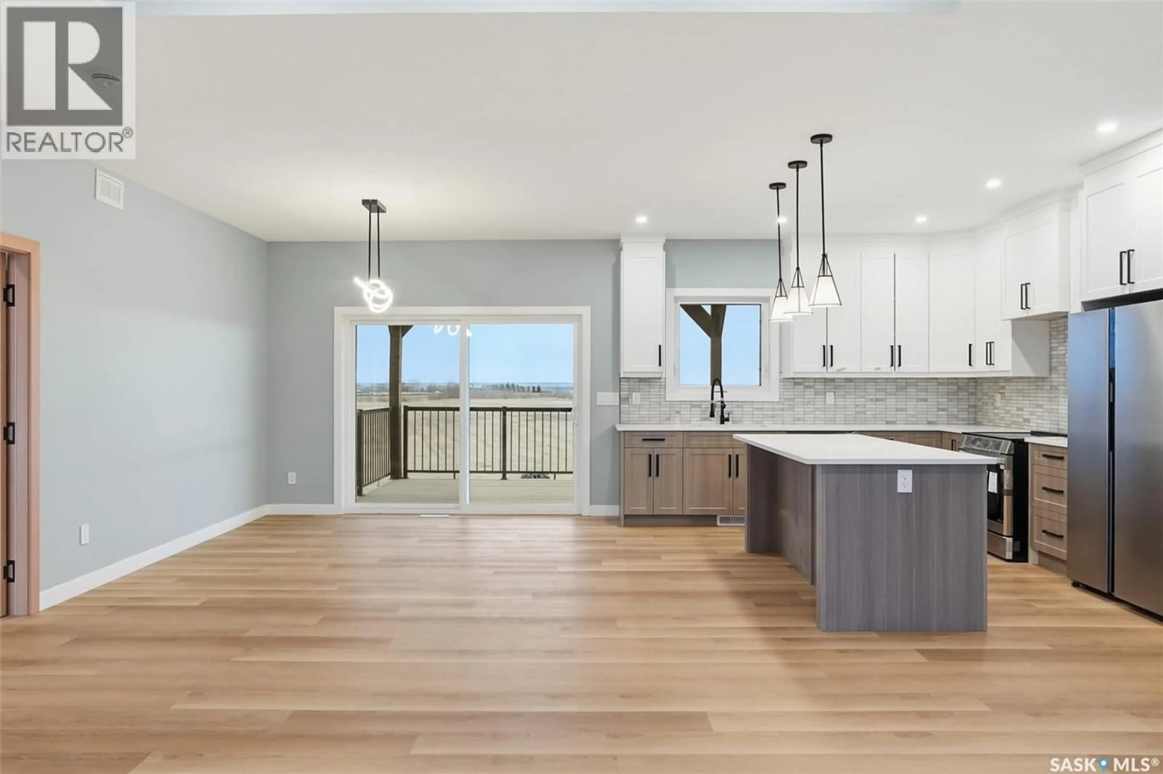 Open concept kitchen, wood/laminate floor for 8 CARDINAL DRIVE, Dundurn Rm No. 314 Saskatchewan S7C0C3