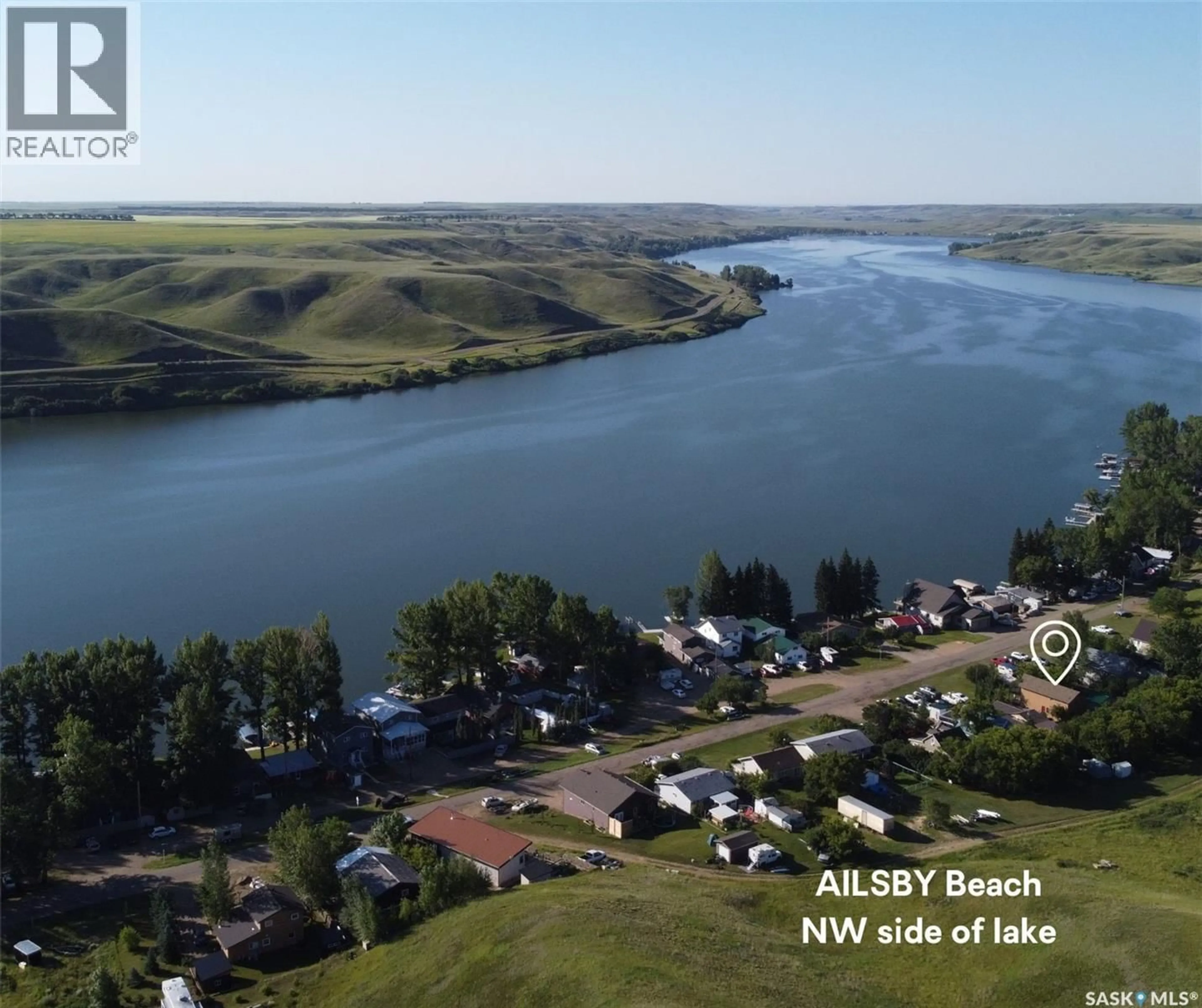 A pic from outside/outdoor area/front of a property/back of a property/a pic from drone, water/lake/river/ocean view for 205 WALL RIDGE TRAIL, Lac Pelletier Rm No. 107 Saskatchewan S0N2Y0