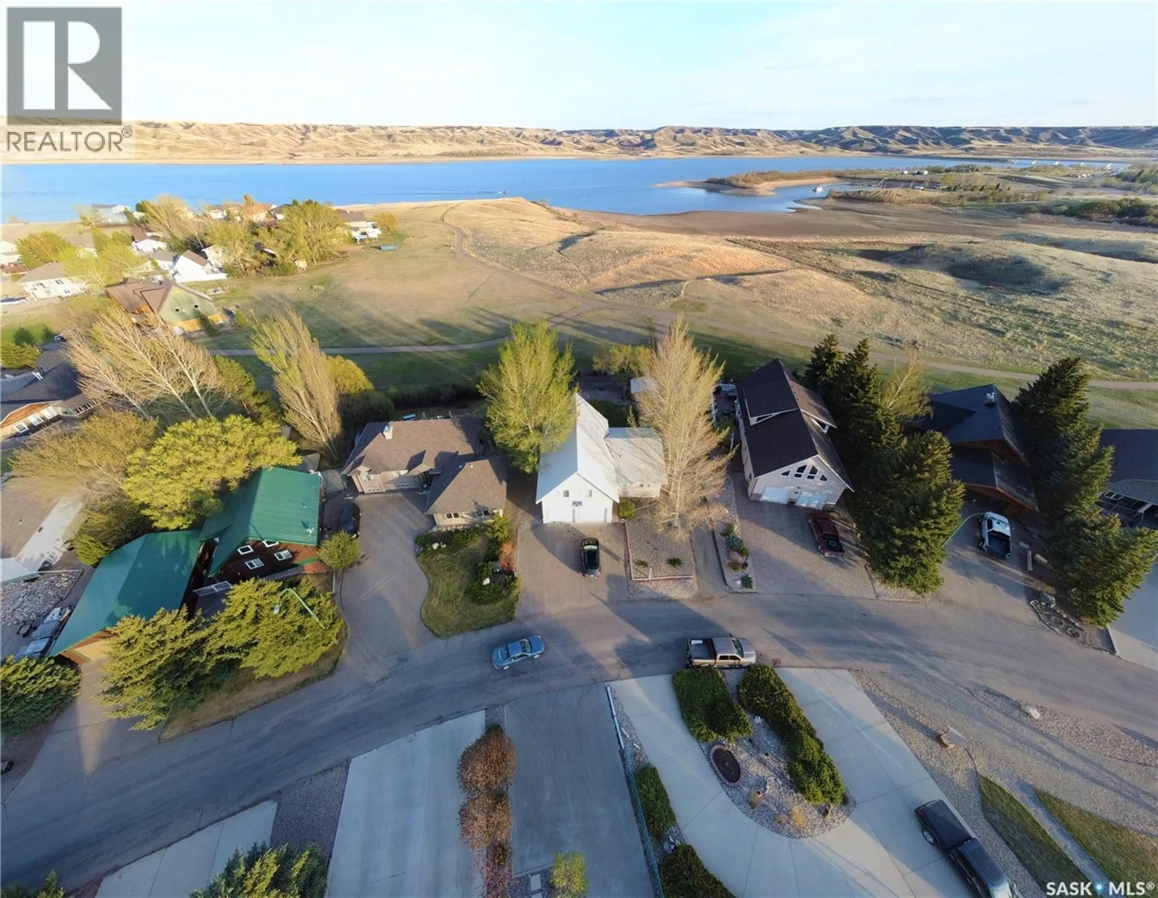 A pic from outside/outdoor area/front of a property/back of a property/a pic from drone, water/lake/river/ocean view for 130 MARINE DRIVE, Saskatchewan Landing Saskatchewan S9H3V6