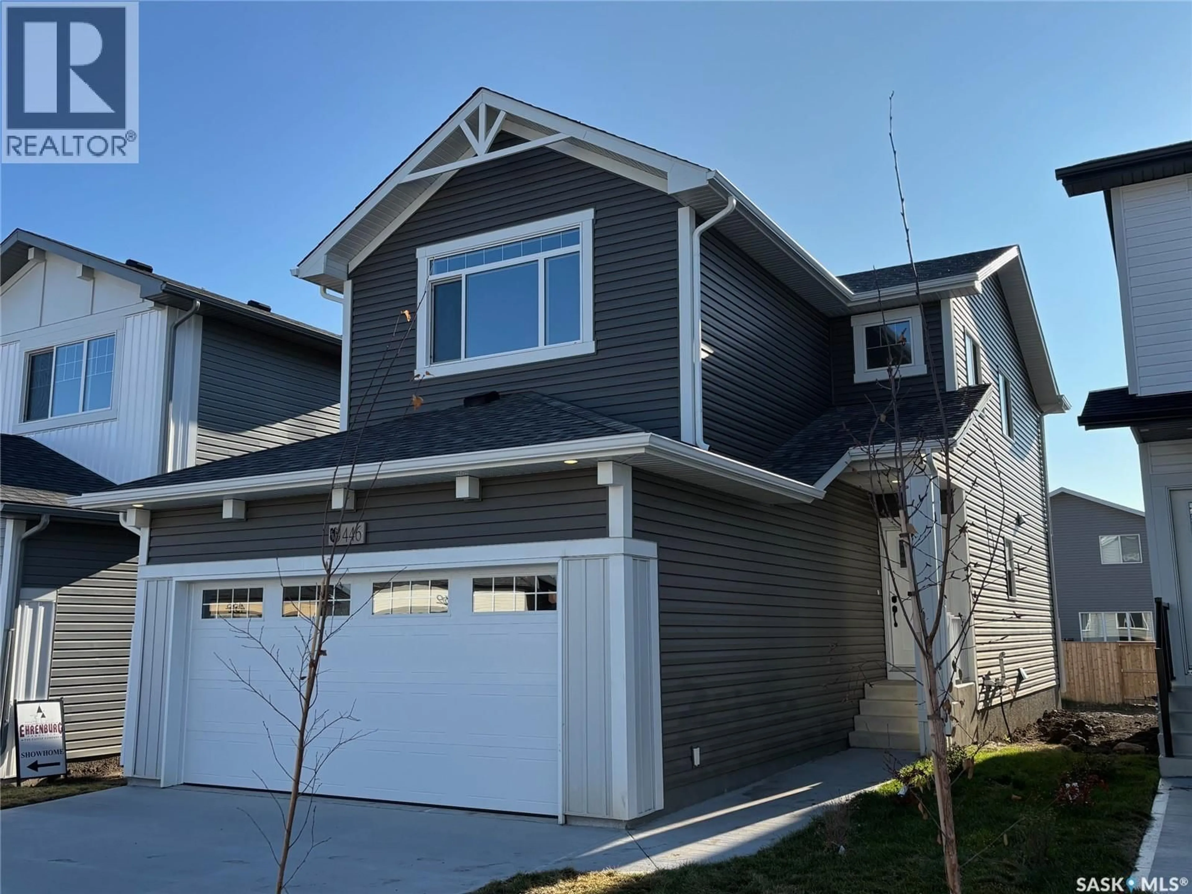 Home with vinyl exterior material, street for 511 TRAEGER MANOR, Saskatoon Saskatchewan S7V1Z8
