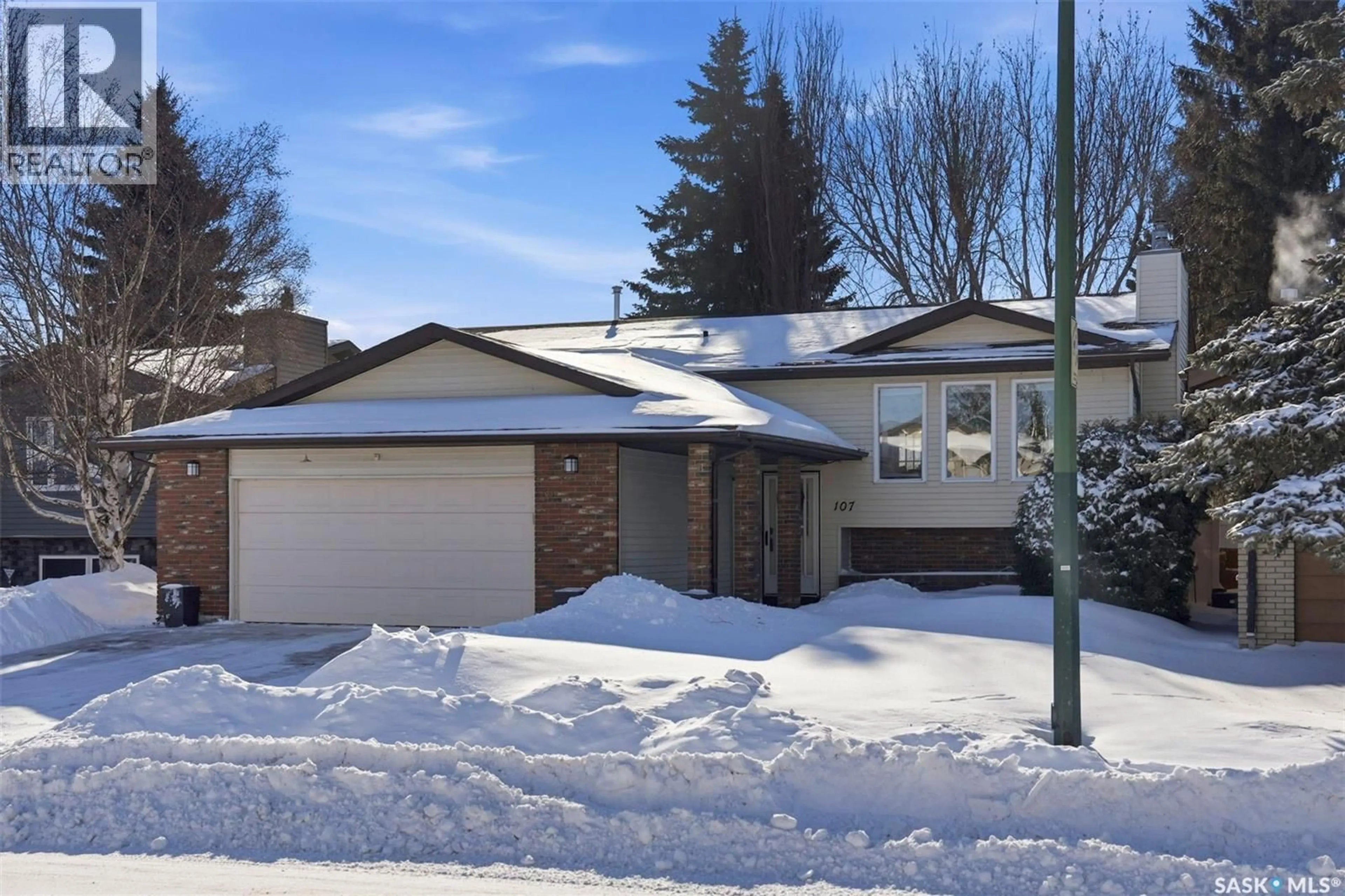 Home with vinyl exterior material, street for 107 PERREAULT CRESCENT, Saskatoon Saskatchewan S7K6A9