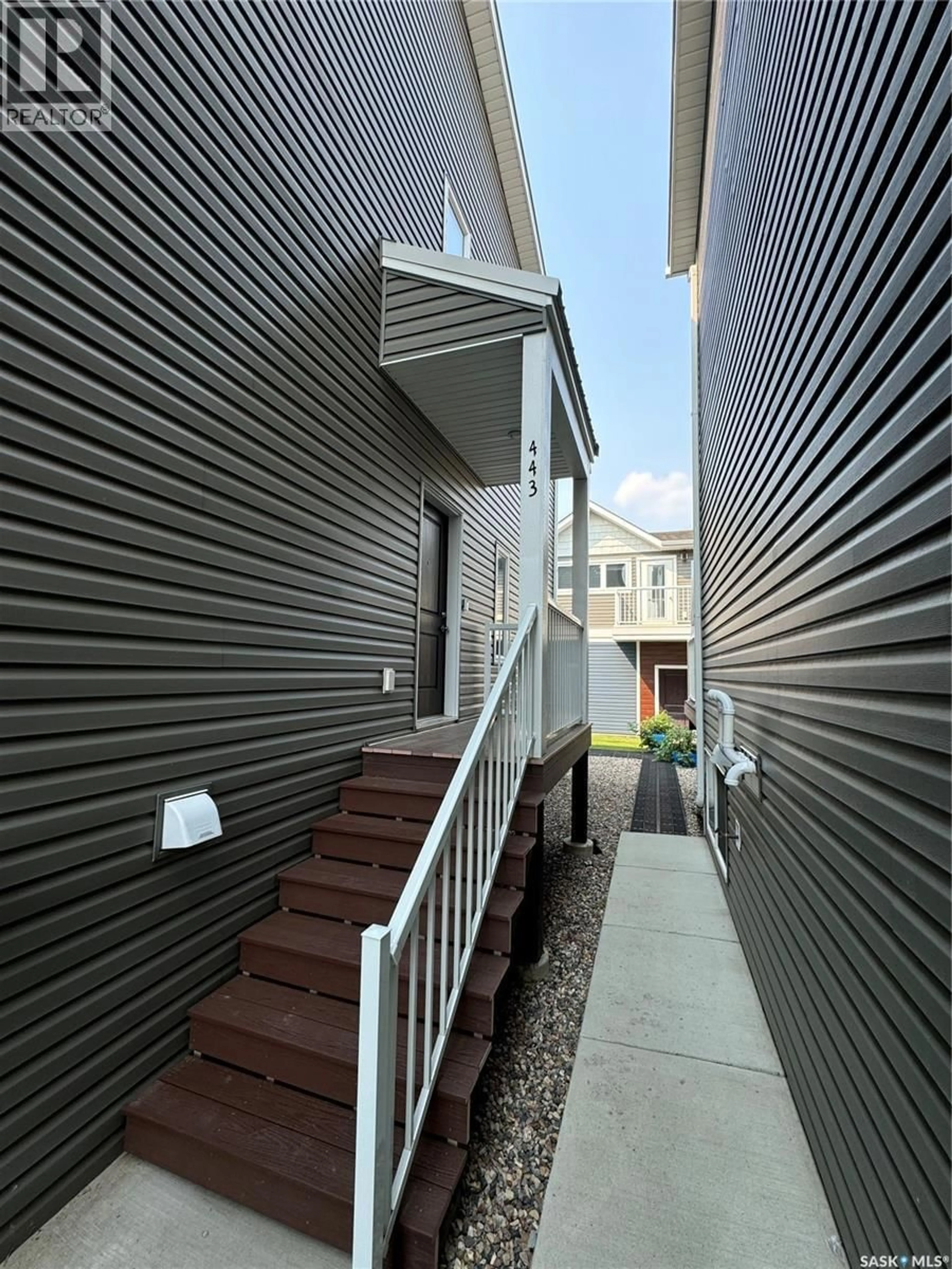 Home with vinyl exterior material, street for 443 L AVENUE, Saskatoon Saskatchewan S7M5Y6