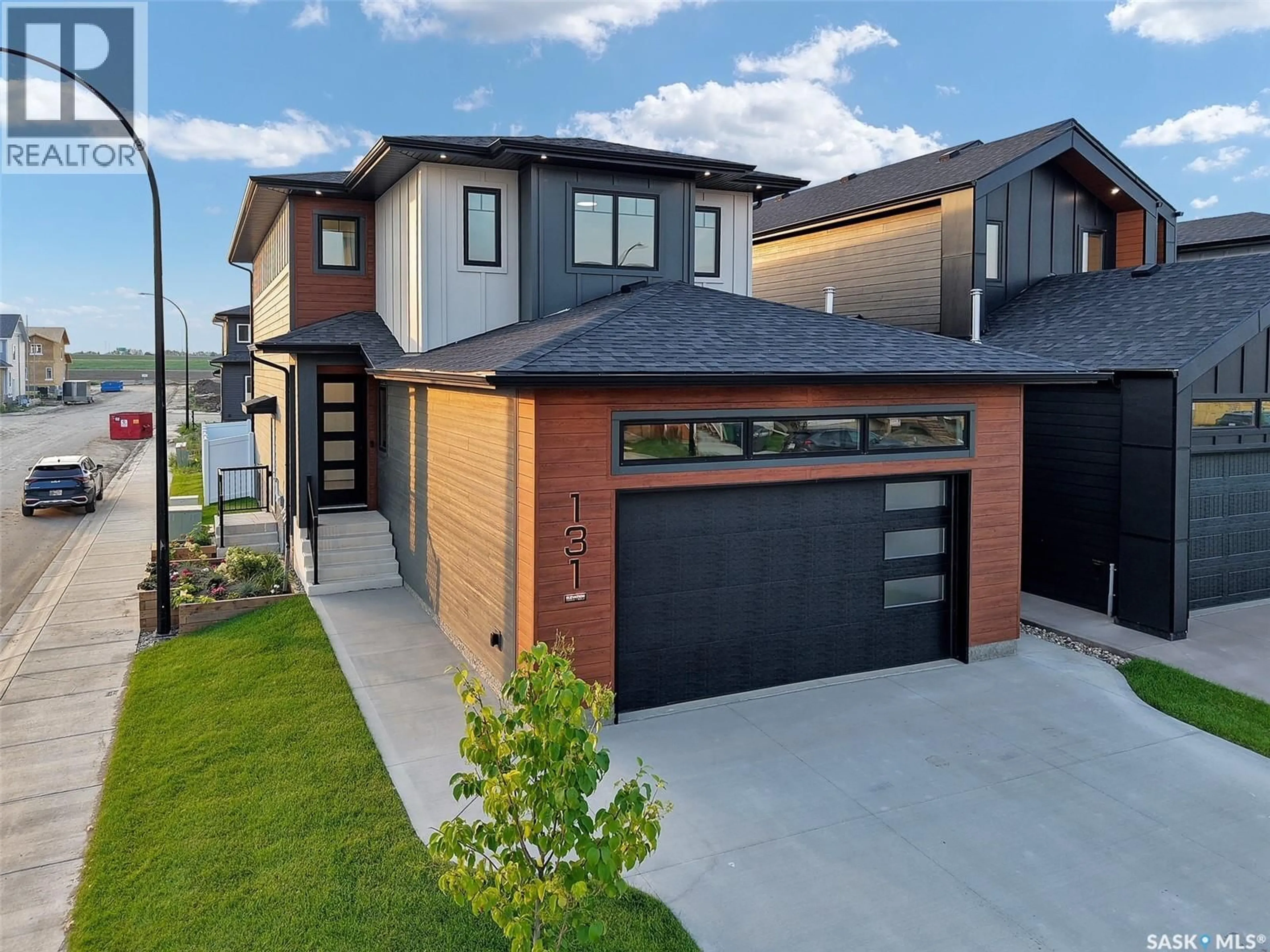 Home with brick exterior material, street for 131 ASOKAN STREET, Saskatoon Saskatchewan S7V1V9