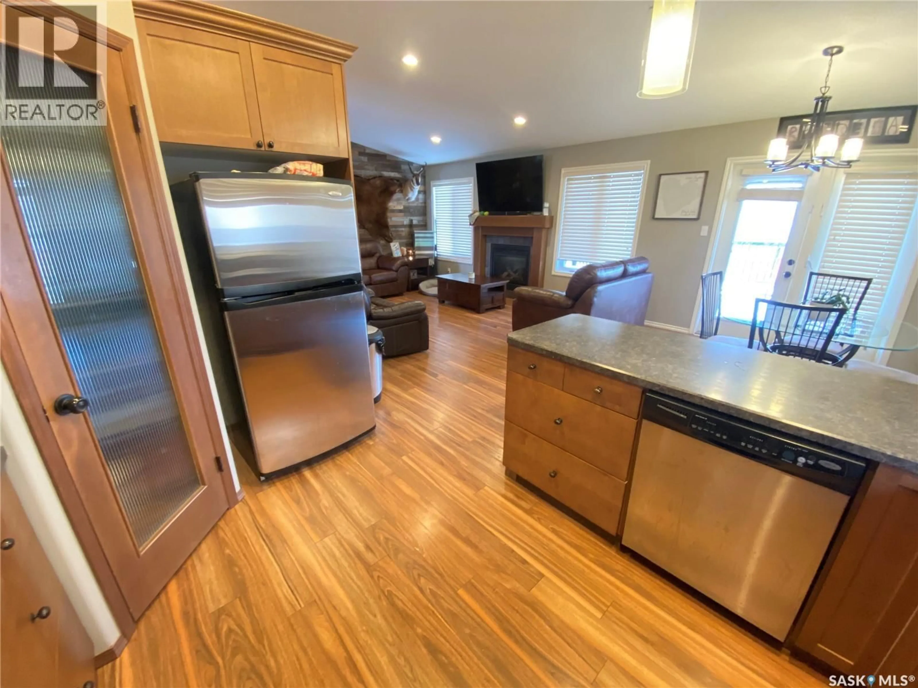 Open concept kitchen, wood/laminate floor for 79 ROSS DRIVE, Yorkton Saskatchewan S3N3Z9