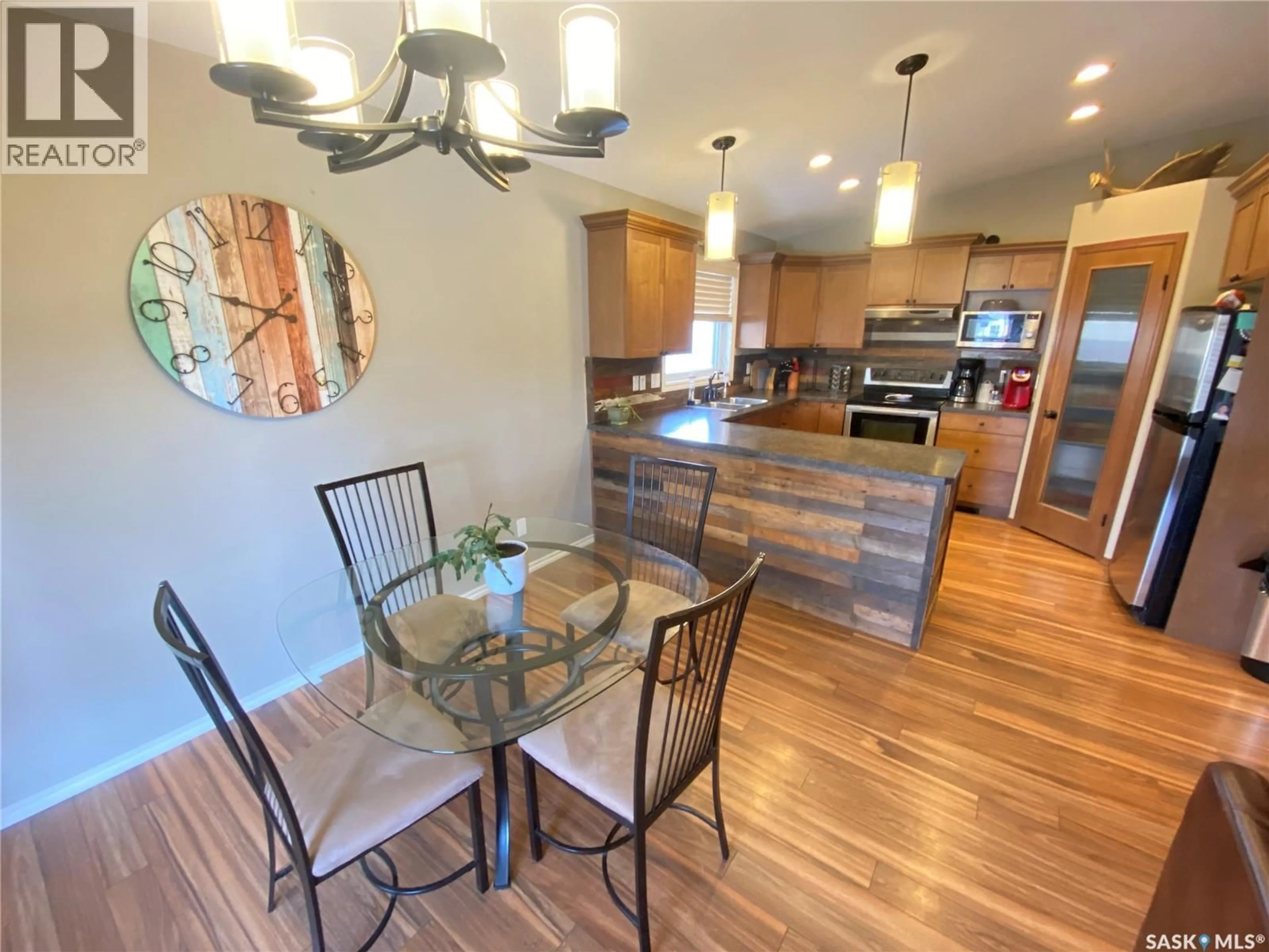 Open concept kitchen, wood/laminate floor for 79 ROSS DRIVE, Yorkton Saskatchewan S3N3Z9
