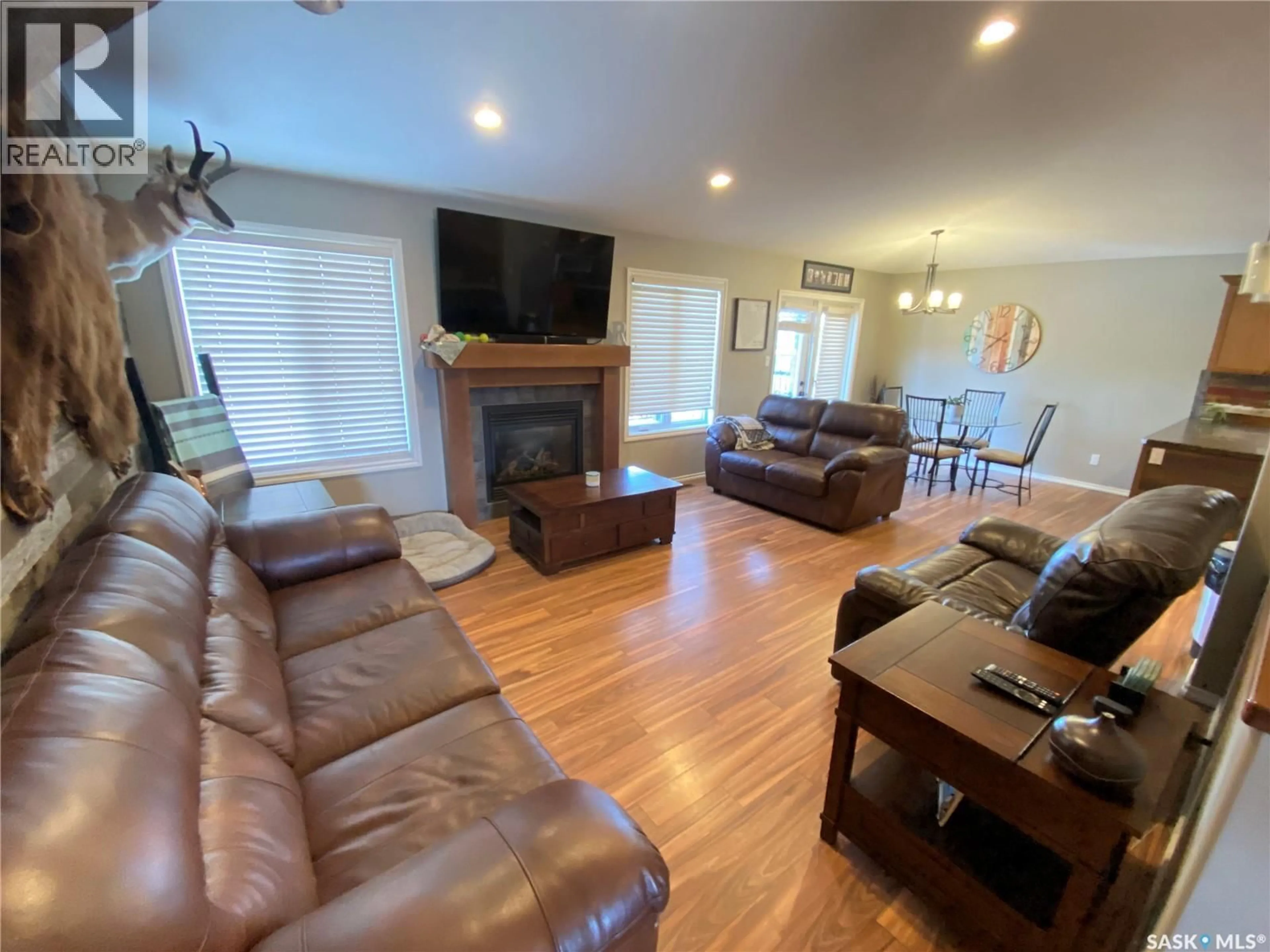 Living room with furniture, wood/laminate floor for 79 ROSS DRIVE, Yorkton Saskatchewan S3N3Z9