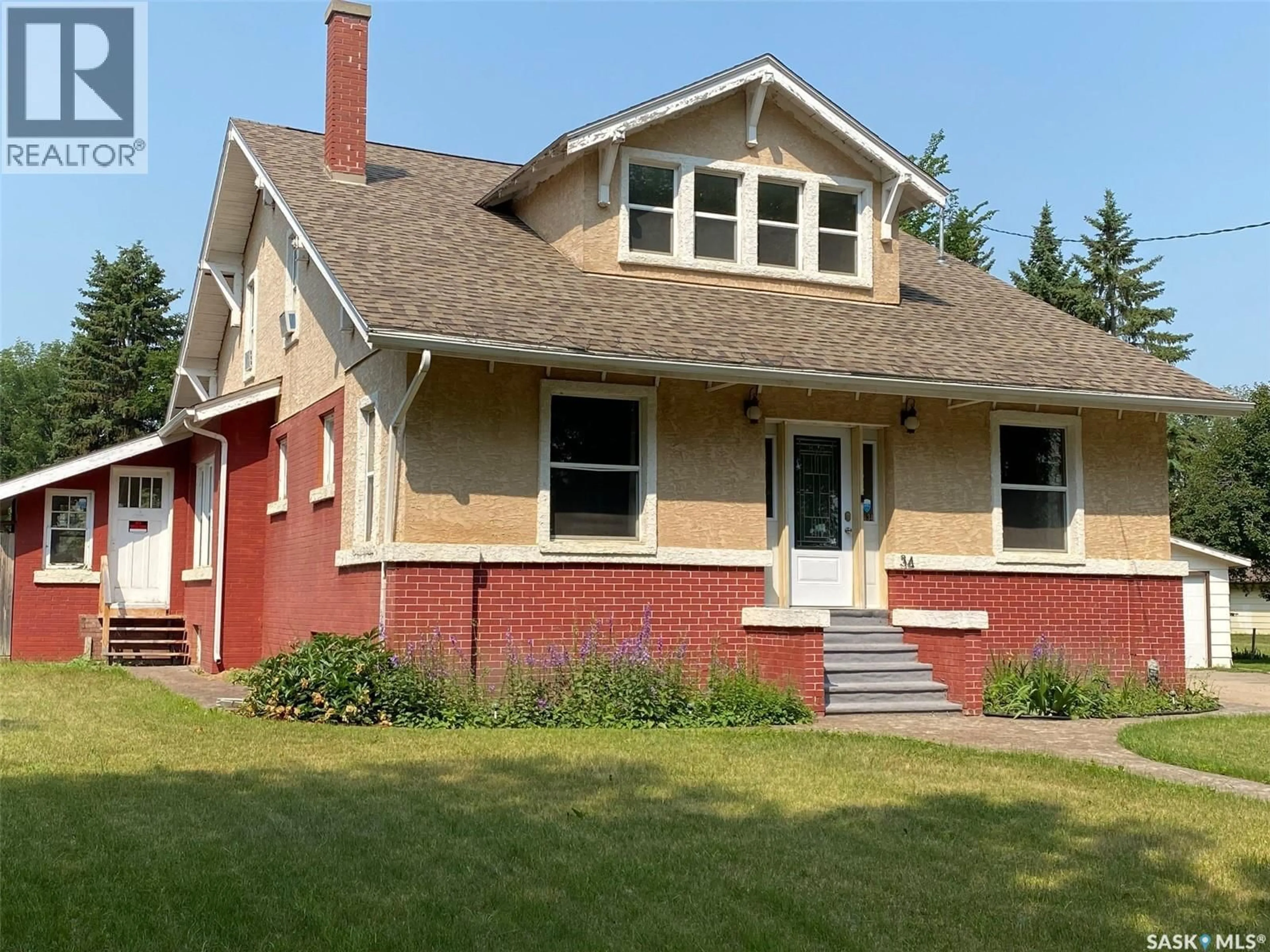 Home with vinyl exterior material, street for 34 LAURIER AVENUE, Yorkton Saskatchewan S3N1T7