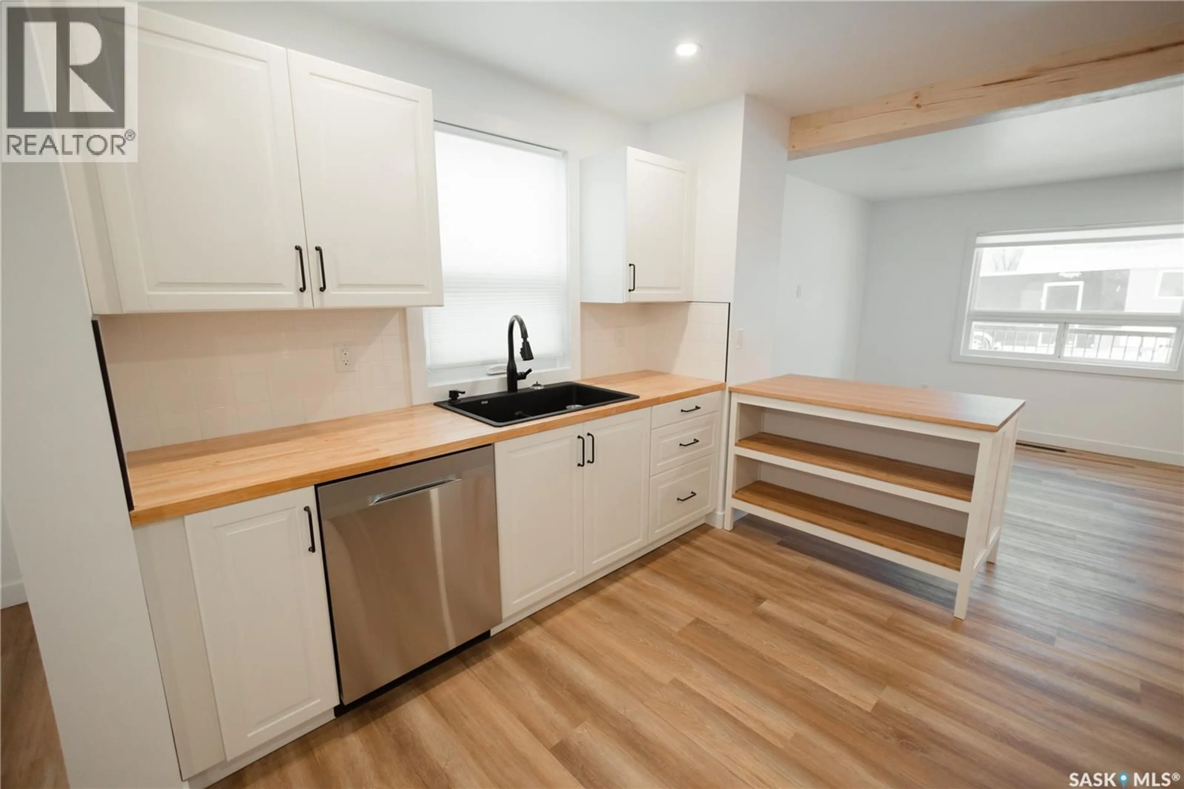 Open concept kitchen, wood/laminate floor for 1041 HASTINGS STREET, Moose Jaw Saskatchewan S6H5R7