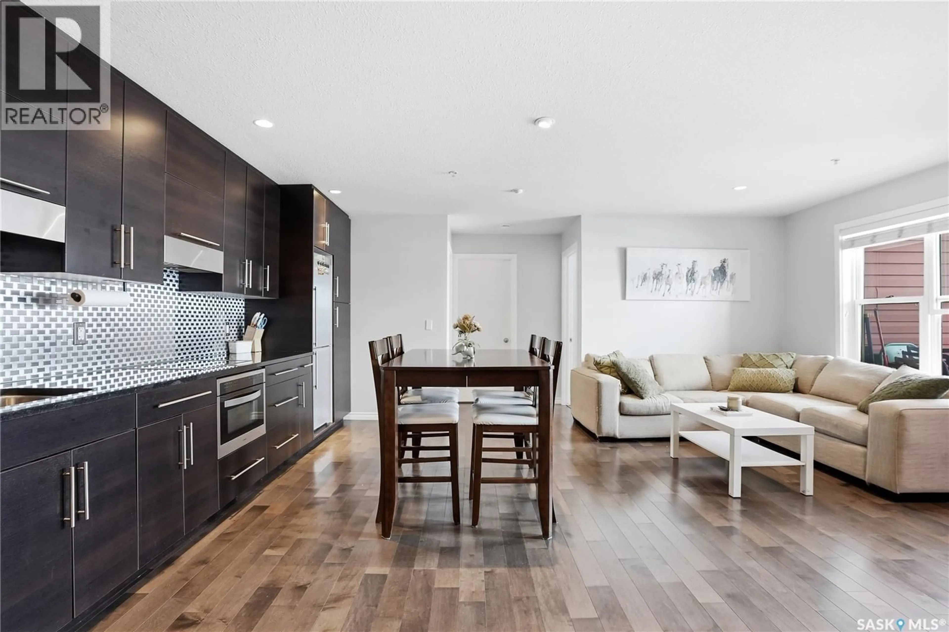 Open concept kitchen, wood/laminate floor for 230 - 105 SLIMMON ROAD, Saskatoon Saskatchewan S7V0B3